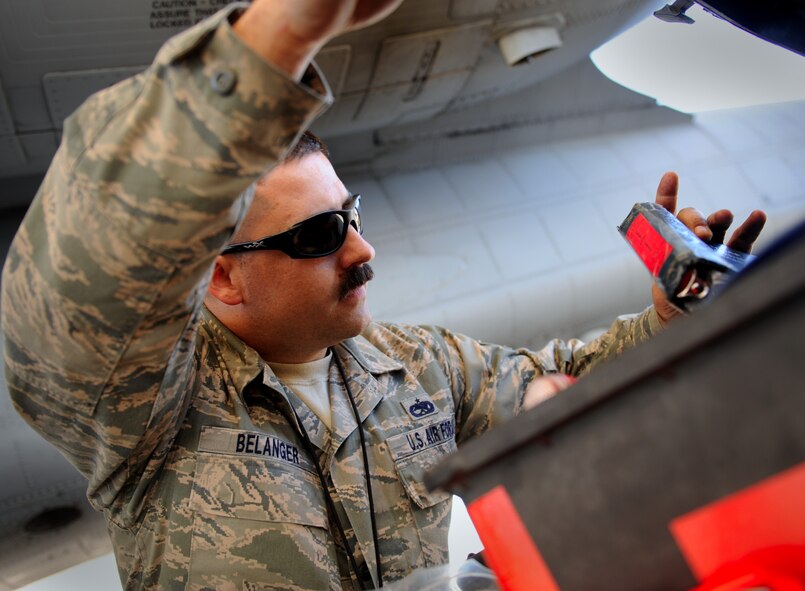 MOODY AIR FORCE BASE, Ga. -- Staff Sgt. Jason Belanger, 23rd Equipment Maintenance Squadron dock team member, looks for a technical order before loading an external fuel tank on to an A-10C Thunderbolt II during a Phase I Operational Readiness Inspection here March 8. A technical order provides instruction on how to properly perform maintenance on certain pieces of equipment. (U.S. Air Force photo by Senior Airman Gina Chiaverotti-Paige)