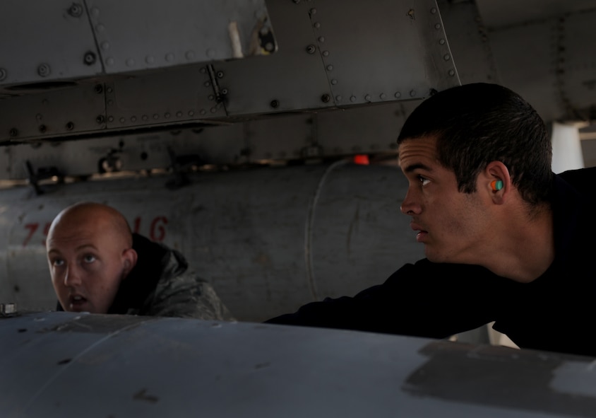 MOODY AIR FORCE BASE, Ga. -- Staff Sgt. Randall Bryant and Senior Airman Jefferson Jeanniton, both 75th Aircraft Maintenance Unit aerospace propulsion technicians, line up an external fuel tank before raising it into place during a Phase I Operational Readiness Inspection here March 8. After this is complete, the aircraft will be ready for inspection by the Inspector General team. (U.S. Air Force photo by Senior Airman Gina Chiaverotti-Paige)