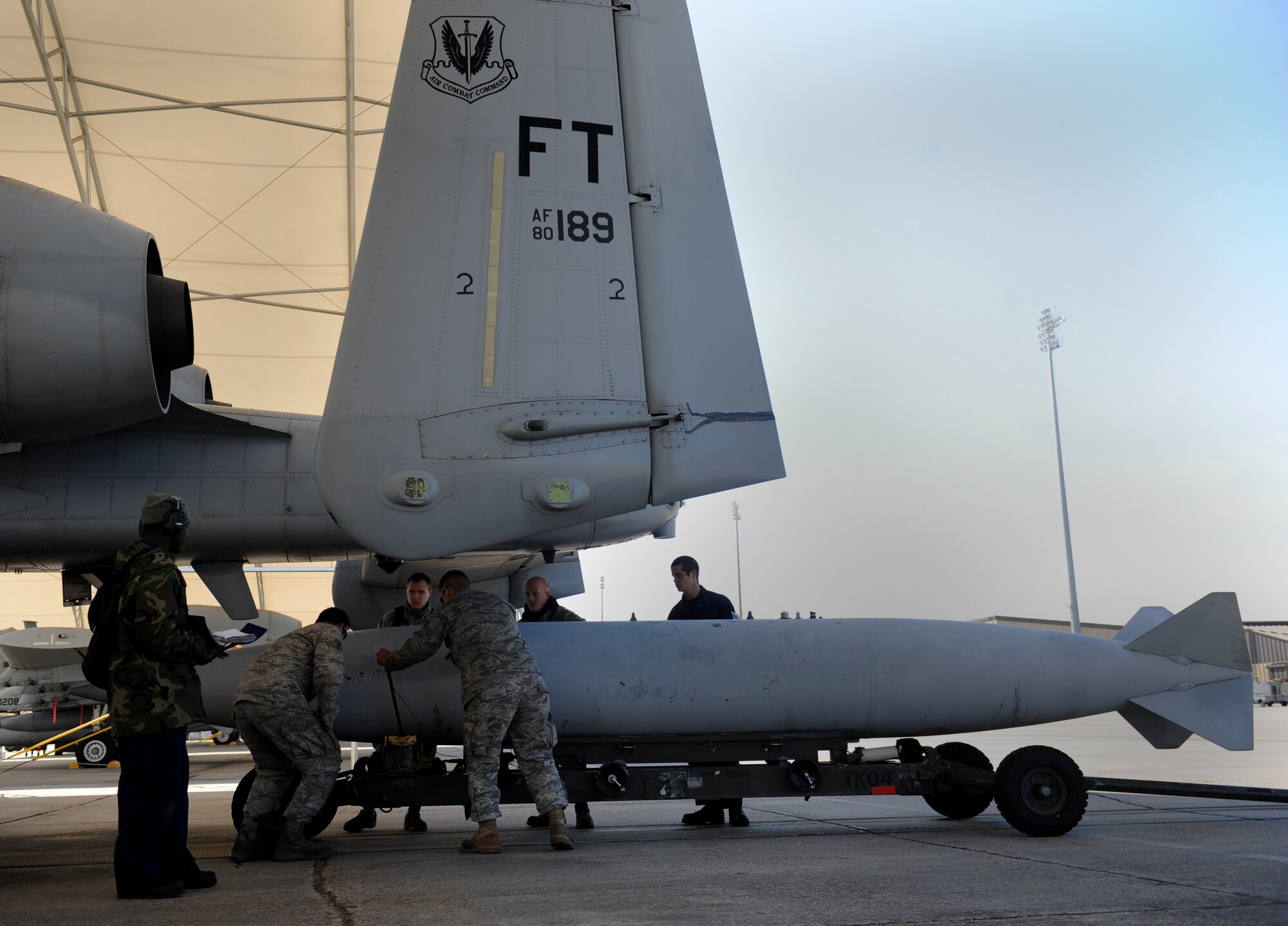 MOODY AIR FORCE BASE, Ga. -- Airmen from the 75th Fighter Squadron maintenance flight move an external fuel tank under an A-10C Thunderbolt II during a Phase I Operational Readiness Inspection March 8. Approximately 36 aircraft were generated during the inspection. (U.S. Air Force photo by Senior Airman Gina Chiaverotti-Paige)