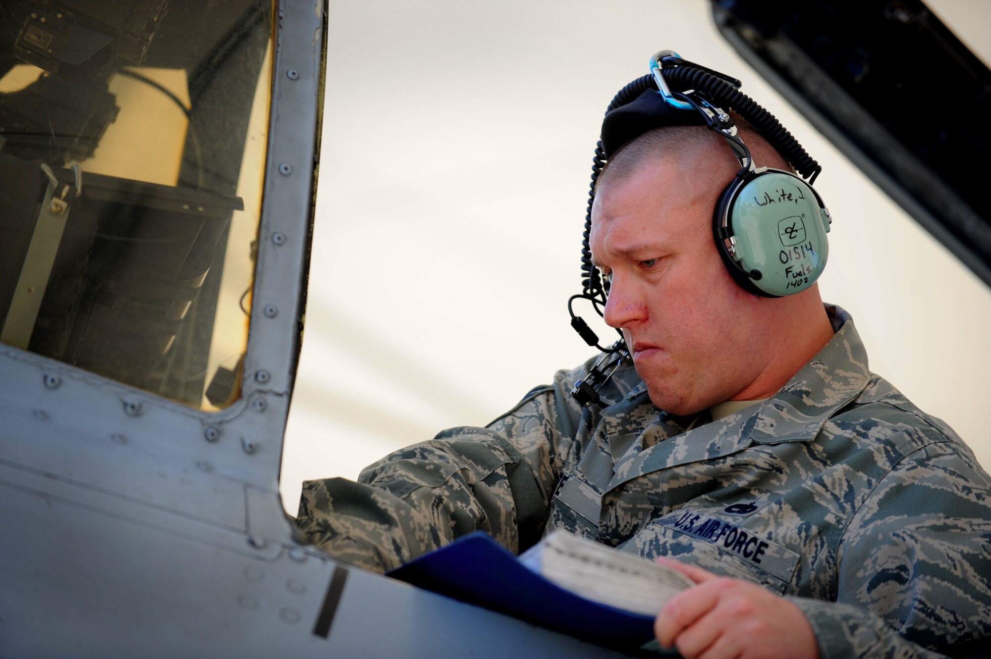 MOODY AIR FORCE BASE, Ga. -- A maintenance Airman looks over a technical order while performing maintenance on a 75th Fighter Squadron A-10C Thunderbolt II during a Phase I Operational Readiness Inspection here March 8. Members from the Air Combat Command Inspector General ORI team, Langley Air Force Base, Va., tested the wing on how well it prepares for a short-notice deployment tasking. (U.S. Air Force photo by Senior Airman Gina Chiaverotti-Paige)