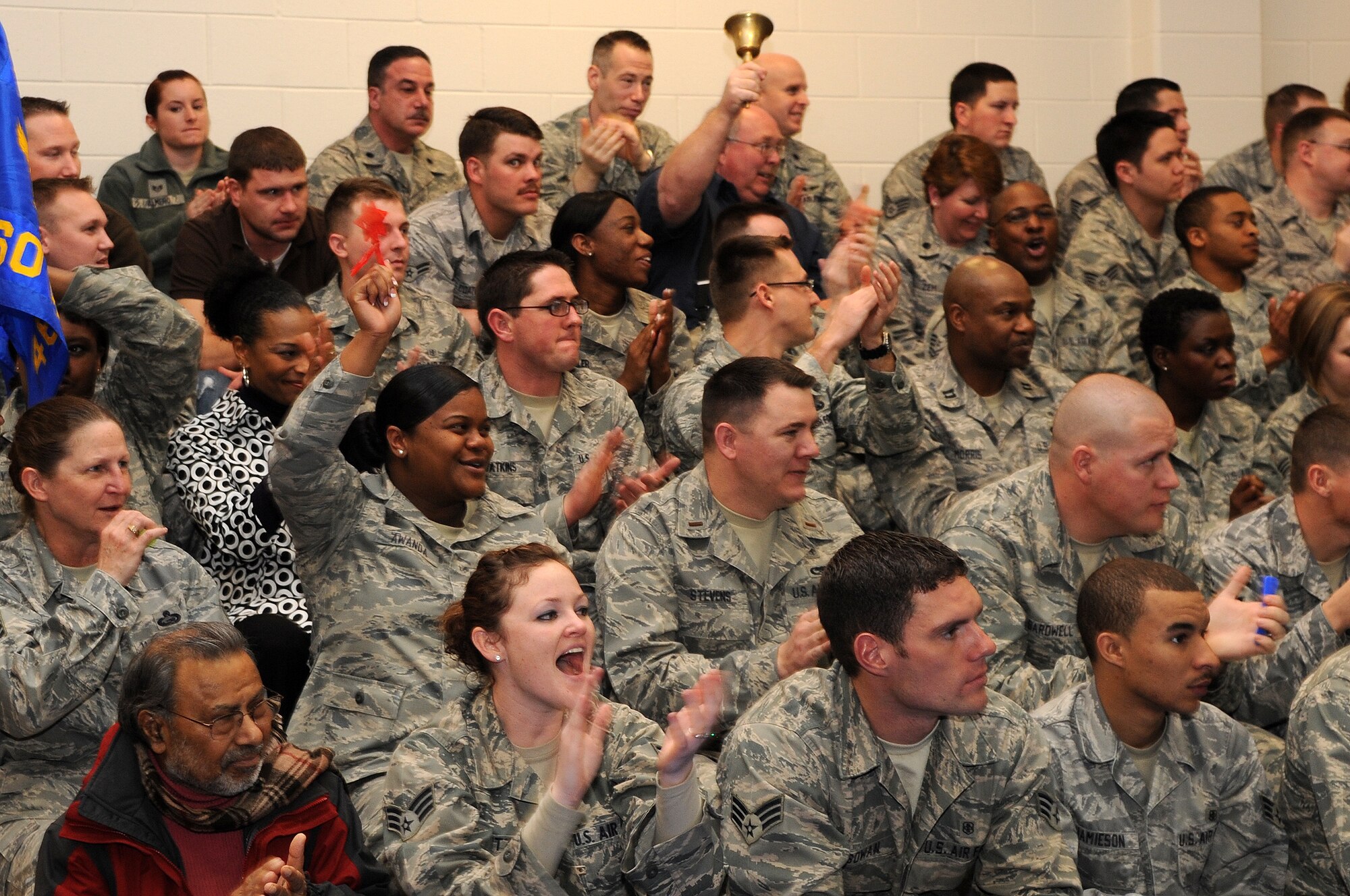 BUCKLEY AIR FORCE BASE, Colo. -- 460th Medical Group Airmen cheer after hearing their performance review during the Operational Readiness / Unit Compliance Inspection outbrief March 10. Team Buckley passed the no-notice ORI/UCI with a satisfactory rating. ( U.S. Air Force Photo by Airman 1st Class Marcy Glass )





