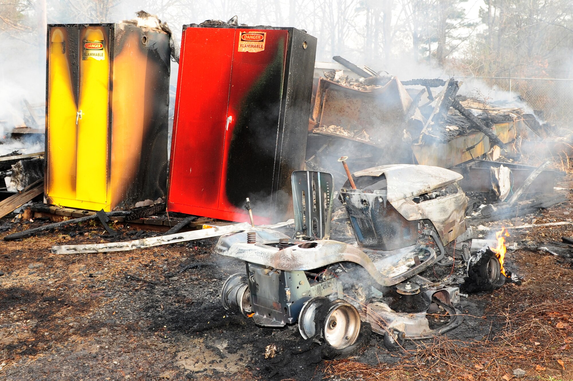 A lawnmower and two flammable storage lockers were among the tools and equipment lost when two Army and Air Force Exchange Service trailers caught fire in the early morning hours of March 7. The trailers were being used by AAFES employees for storage. No one was injured in the fire, the cause of which is still under investigation. Officials estimate approximately $75,000 in damage. (U.S. Air Force photo by Senior Airman Steele C. G. Britton)
