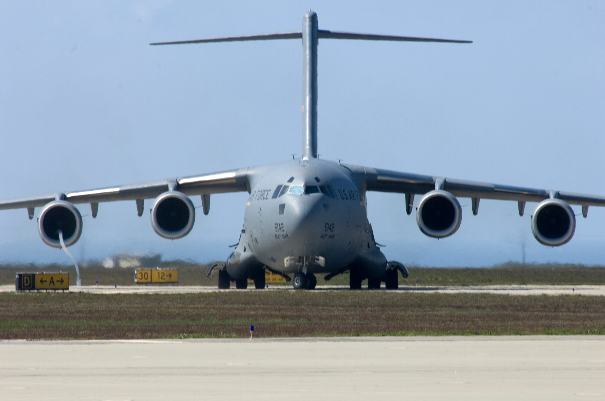 VANDENBERG AIR FORCE BASE, Calif. -- A C-17 Globemaster III, stationed at March Air Reserve Base, Calif., performs a reverse thrust maneuver for training here Tuesday, March 9, 2010. While there are no active flying squadrons, Vandenberg's runway is often used for training not only for aircraft, but for emergency response as well. (U.S. Air Force photo/Staff Sgt. Levi Riendeau)