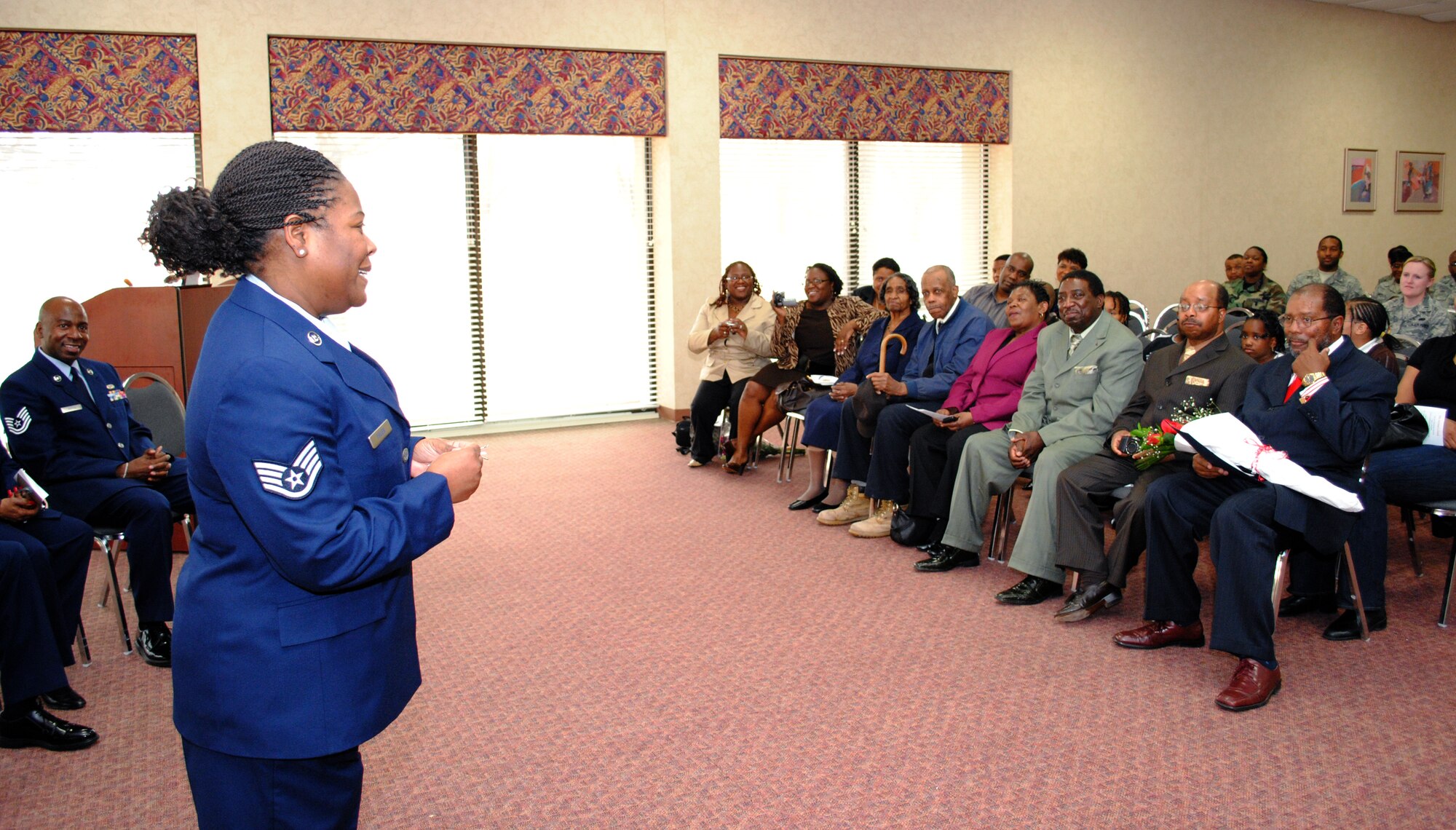 Staff Sgt. Denise Fuller, 94th Services information management specialist, reflects on her years of service to the Air Force to friends, family members and fellow Airmen during the 94th Services Retirement Ceremony on March 7 at Dobbins Air Reserve Base.

   “I enjoyed the family orientation of my unit,” said Sergeant Fuller.  (U.S. Air Force photo/Master Sgt. Stan Coleman)
