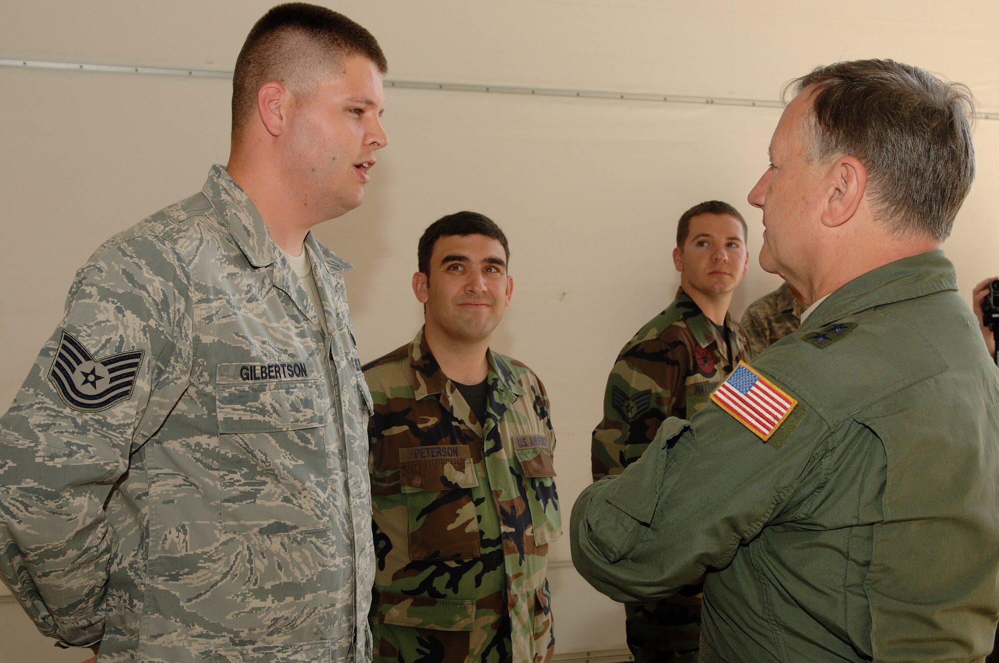 JOINT BASE PEARL HARBOR HICKAM, Hickam -- Tech. Sgt. Joshua Gilbertson,  15th Maintenance Squadron, speaks with Maj. Gen. Fred F. Roggero, Air Foprce chief of safety, concerning the history of his teams safety record. General Roggero is on his first tour of the Pacific region since taking the chief of safety position. (U.S. Air Force photo/Mark Anthony Bates) 