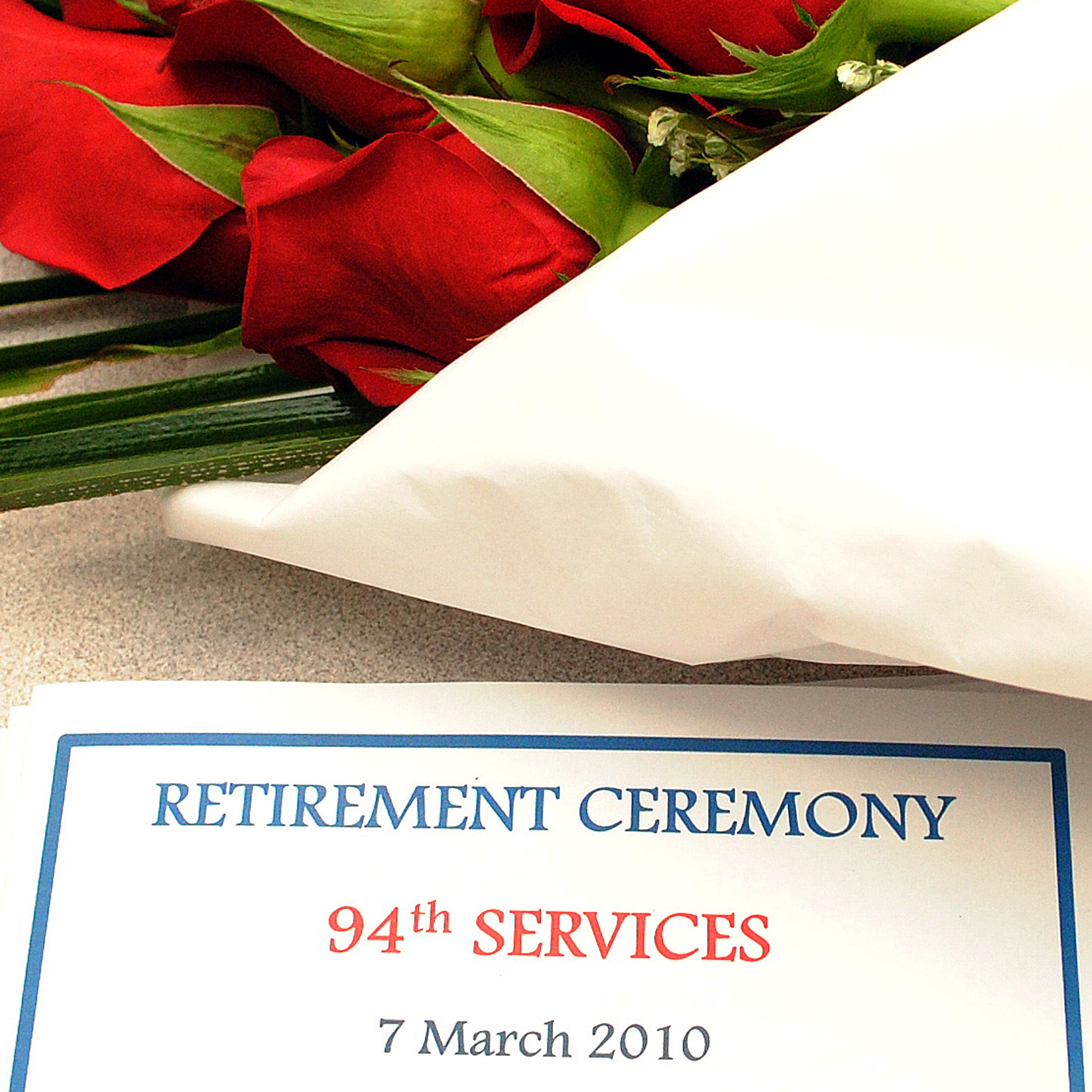 A bouquet of roses and the unit retirement ceremony program symbolizes the 100-plus years of service for four Airmen celebrating their years of military service with the 94th Services Squadron on Sunday, March 7, at Dobbins Air Reserve Base.

  The retiring Airmen are Master Sgt. Ronald Little, Tech. Sgt. Jessica King, Tech. Sgt. Danny Griffin, and Staff Sgt. Denise Fuller.  (U.S. Air Force photo/Master Sgt. Stan Coleman)
