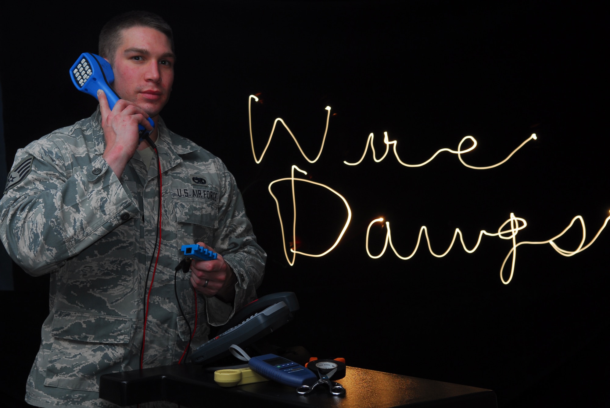 BUCKLEY AIR FORCE BASE, Colo. -- Staff Sgt. Corey Frint, 460th Space Communications Squadron infrastructure systems technician, ensures that voice systems around the base work properly. (U.S. Air Force photo by Tech. Sgt. Anika Williams)