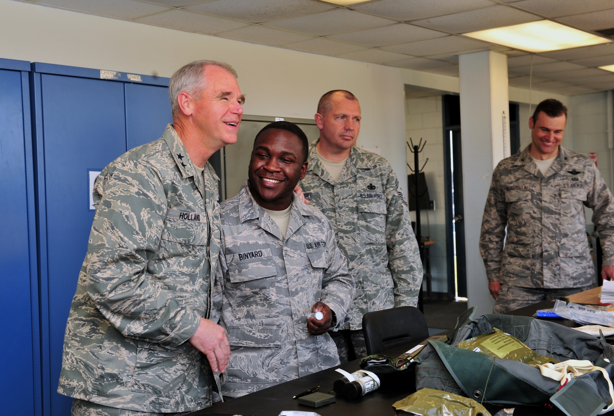 SHAW AIR FORCE BASE, S.C. -- Major Gen. William Holland, Ninth Air Force commander, shares a laugh with Senior Airman Warren Binyard at the aircrew flight equipment building March 9. General Holland and his wife Norma were making an official visit to the 20th Fighter Wing. (U.S. Air Force photo/Airman 1st Class Amber E. N. Jacobs)