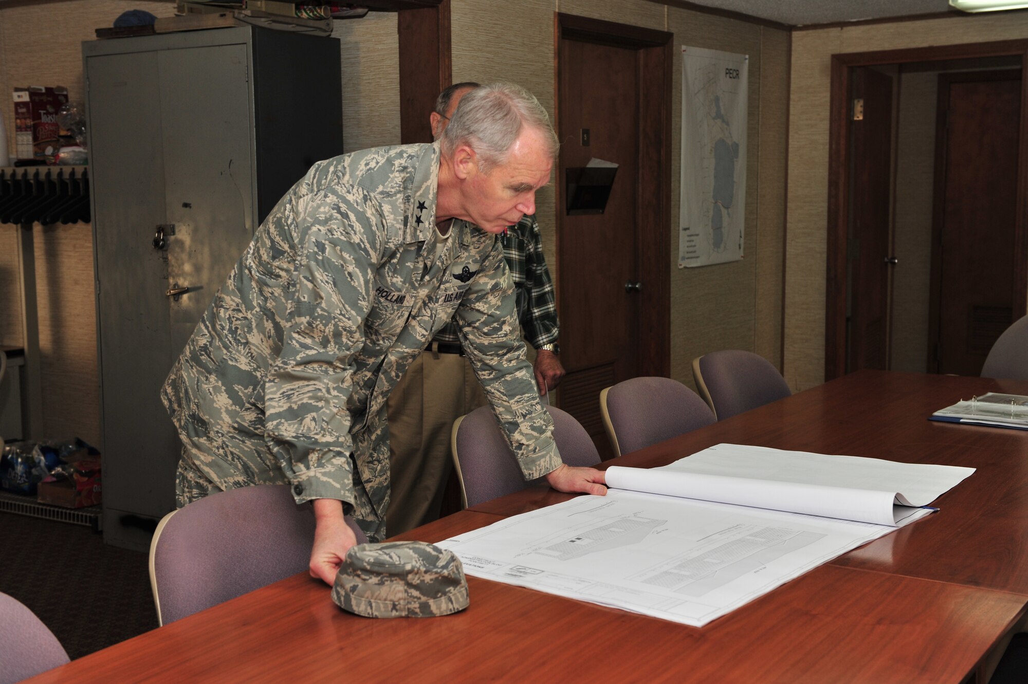 SHAW AIR FORCE BASE, S.C. -- Major Gen. William Holland, Ninth Air Force commander, reviews the construction plans for the new building at the Poinsett Electronic Combat Range March 9. General Holland and his wife Norma were making an official visit to the 20th Fighter Wing. (U.S. Air Force photo/Airman 1st Class Amber E. N. Jacobs)