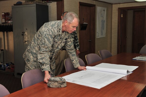 SHAW AIR FORCE BASE, S.C. -- Maj. Gen. William Holland, Ninth Air Force commander, reviews the construction plans for the new building at the Poinsett Electronic Combat Range, March 9. General Holland and his wife, Norma, made an official visit to the 20th Fighter Wing. (U.S. Air Force photo/Airman 1st Class Amber E. N. Jacobs)