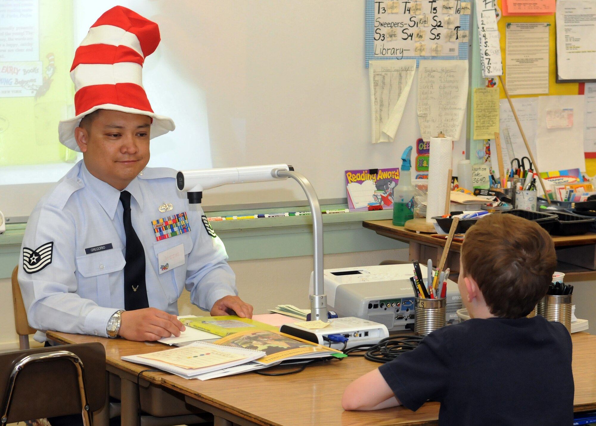 Tech Sgt. Jessie Gregorio reads to a class of students during the Read Across America event at Eshelman Avenue Elementary School, March 2.  The tech sergeant attended the school as an elementary school student.  (Photo by Jim Gordon)