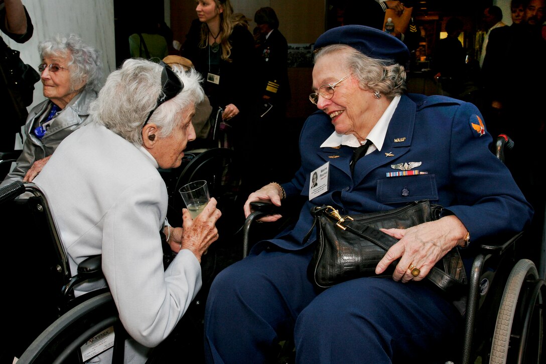 Ola "Roxie" Rexroat and Maxine Flournoy, both former pilots who flew with the Women Airforce Service Pilots during World War II, attend a reception to honor the 1,102 pilots at the Women in Military Service For America Memorial at Arlington National Cemetery, Va., March 2010. The ceremony was part of a two-day event in which all WASPs will receive the Congressional Gold Medal for their service.  DoD photo by Linda Hosek. 