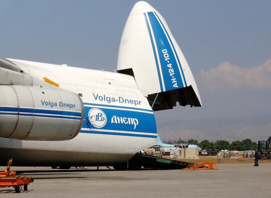 A Volga-Dnepr Airlines Antonov An-124-100 cargo aircraft unloads relief supplies at the Port au Prince airport shortly after the Jan. 12 earthquake that devastated Haiti. Tech. Sgt. Kyle Boles, a flight safety NCO at Vance AFB, was deployed to Haiti to help with the relief supplies airlift. (U.S. Air Force photo/ Tech. Sgt. Kyle Boles)