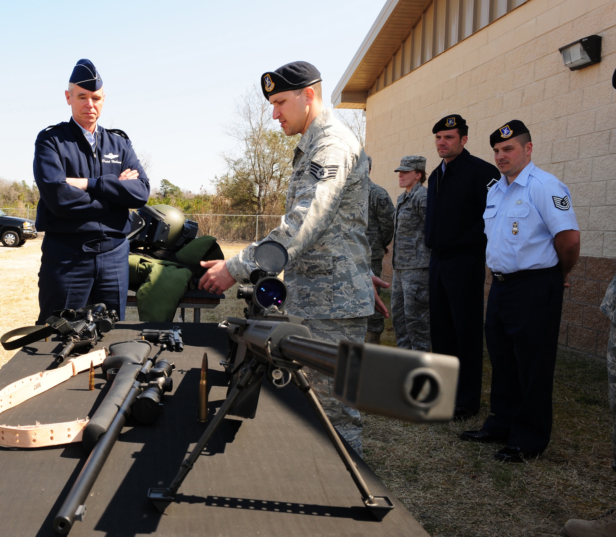 SHAW AIR FORCE BASE, S.C. -- Major Gen. William Holland, Ninth Air Force commander, is briefed by Staff Sgt. Gary Chapin of the 20th Security Forces Squadron on the .50-caliber rifle March 8. General Holland and his wife Norma were making an official visit to the 20th Fighter Wing. (U.S. Air Force photo/Airman 1st Class Neil D. Warner)