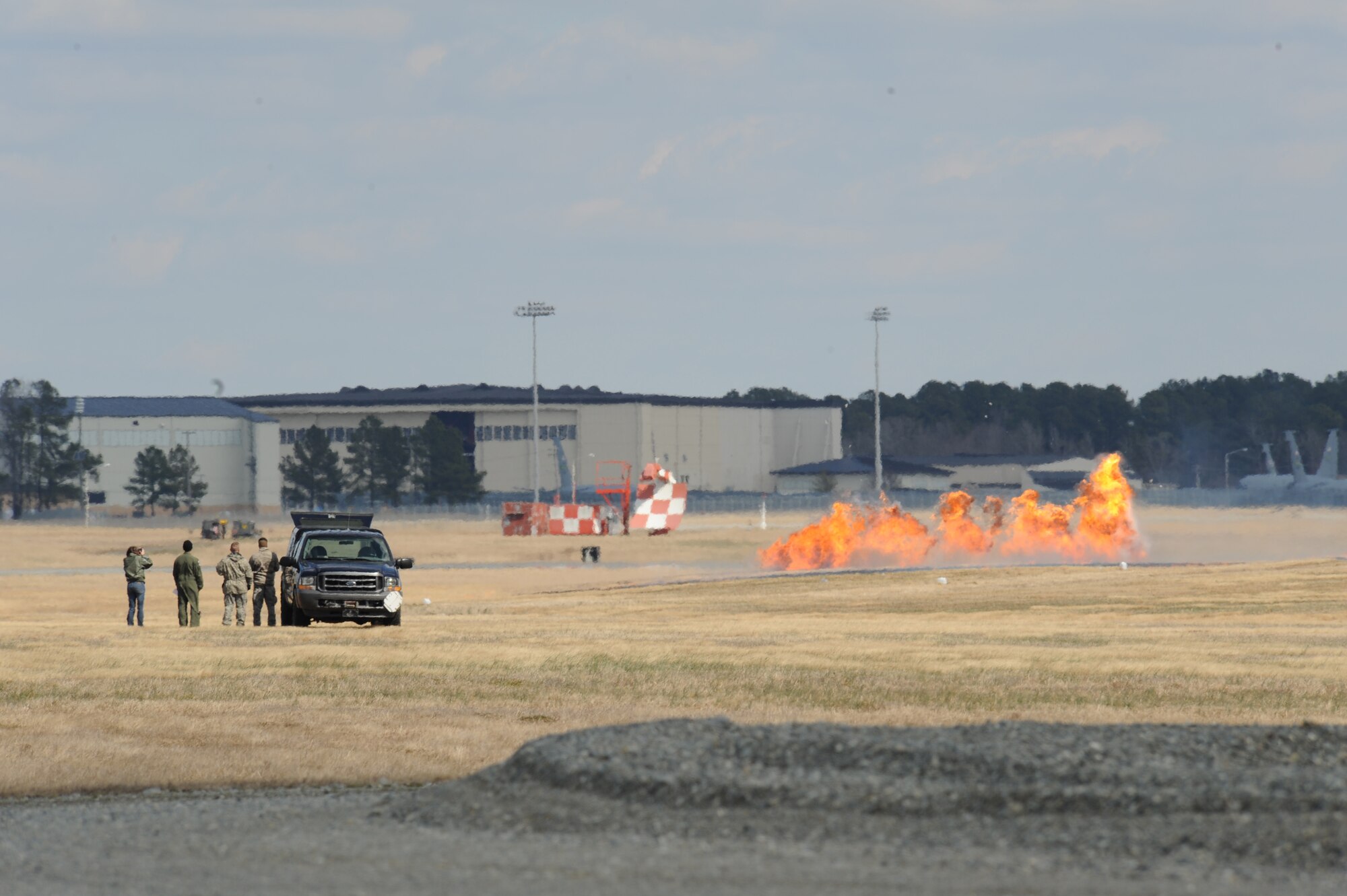 Members from the 4th Civil Engineer Squadron explosive ordnance disposal flight setup a simulated strafing run during an airpower demonstration on Seymour Johnson Air Force Base, N.C., March 4, 2010. Strafing is when a low-flying aircraft attacks a ground target and, although the earliest use of military aircraft was for observing and directing counter attacks, was frequently practiced in World War I.(U.S. Air Force photo/Staff Sgt. Courtney Richardson)