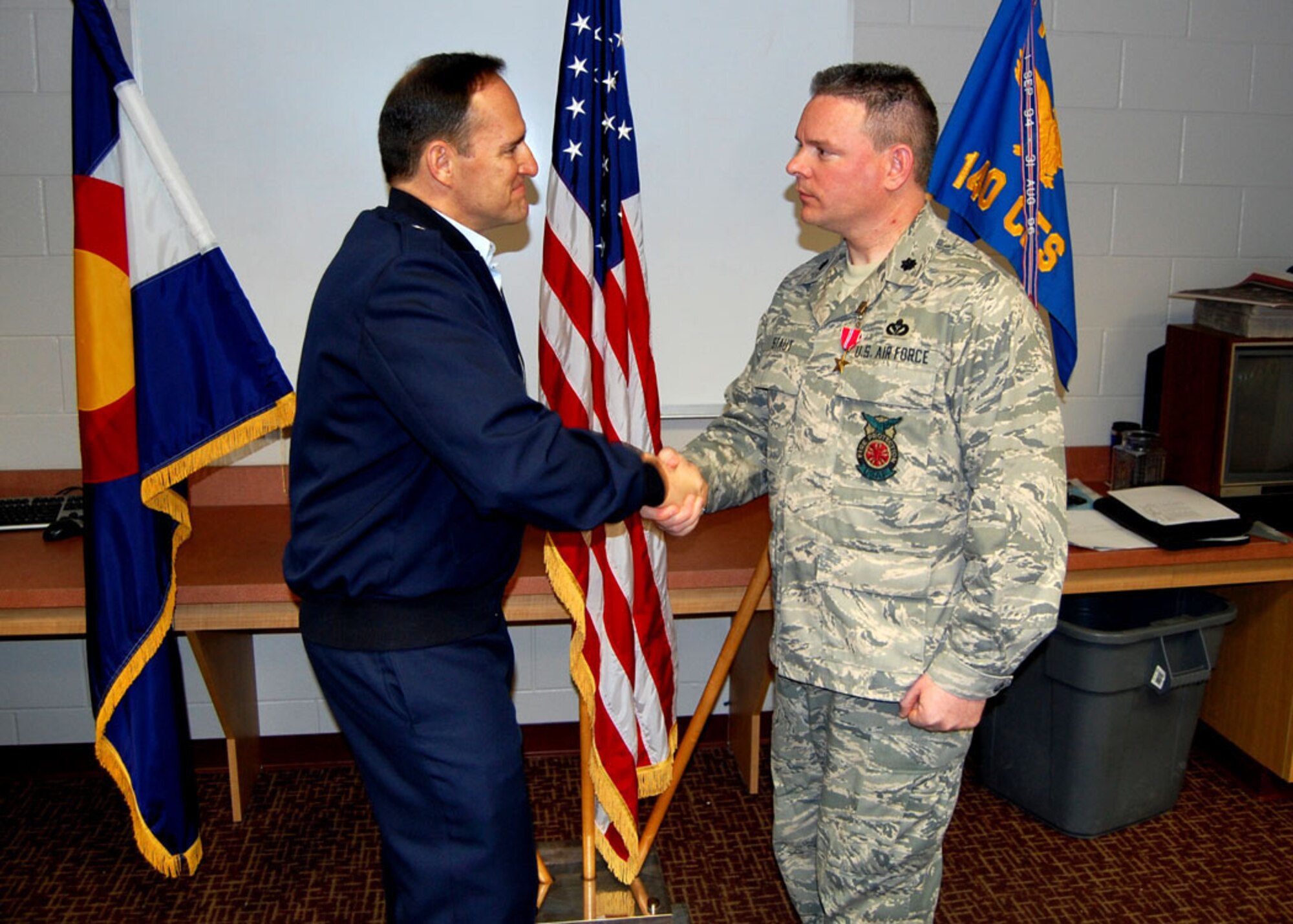 On Saturday, March 6th, Lt. Colonel Gregory Staut, Commander of the 140th Civil Engineering Squadron, was presented with the Bronze Star by 140th Wing Commander Brig. Gen. Trulan Eyre.  Staut received the medal for duties performed in support of Operation Iraqi Freedom as commander of Facility Engineering Detachment 4, 732nd Air Expeditionary Group, 332nd Air Expeditionary Wing, Balad Air Base, Iraq. (Air Force Photo by Master Sgt. Rochell Smith, 140th Wing Public Affairs)