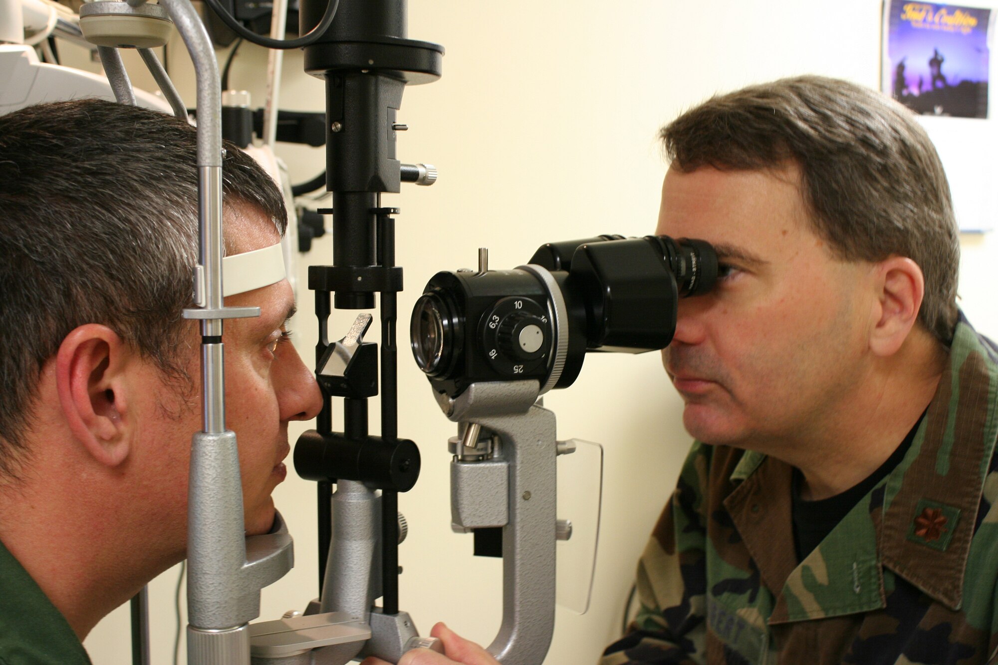 WRIGHT-PATTERSON AIR FORCE BASE, Ohio – Maj. Don Seibert, 445th Aerospace Medicine Squadron, performs an eye exam on Lt. Col. Stan Bascone, 89th Airlift Squadron, as part of the colonel’s annual Reserve Component Periodic Health Assessment conducted during the March. 6 unit training assembly. Reservists are required to have an annual RCPHA, which consists of a medical and dental exam, to maintain medical readiness for deployment and worldwide duty. (U.S. Air Force photo/Tech. Sgt. Jeremy Caskey)