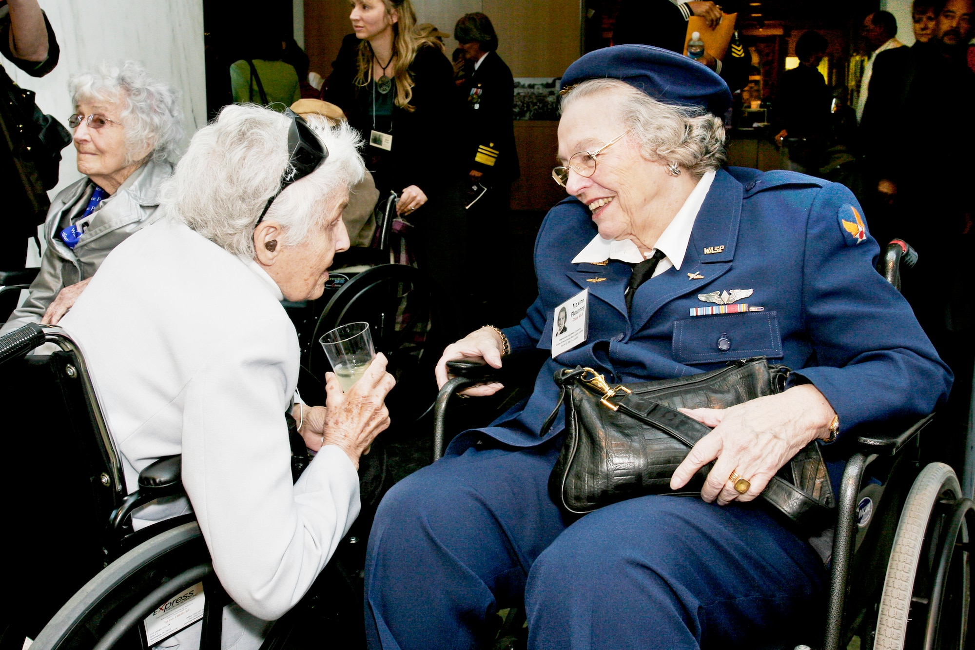 Ola "Roxie" Rexroat and Maxine Flournoy, both former pilots who flew with the Women Airforce Service Pilots during World War II, meet during a reception to honor the 1,102 pilots at the Women in Military Service For America Memorial March 9, 2010, at Arlington National Cemetery, Va. The reception was part of two days of events in which all the women pilots will receive the Congressional Gold Medal at the U.S. Capitol. (Defense Department photo/Linda Hosek)
