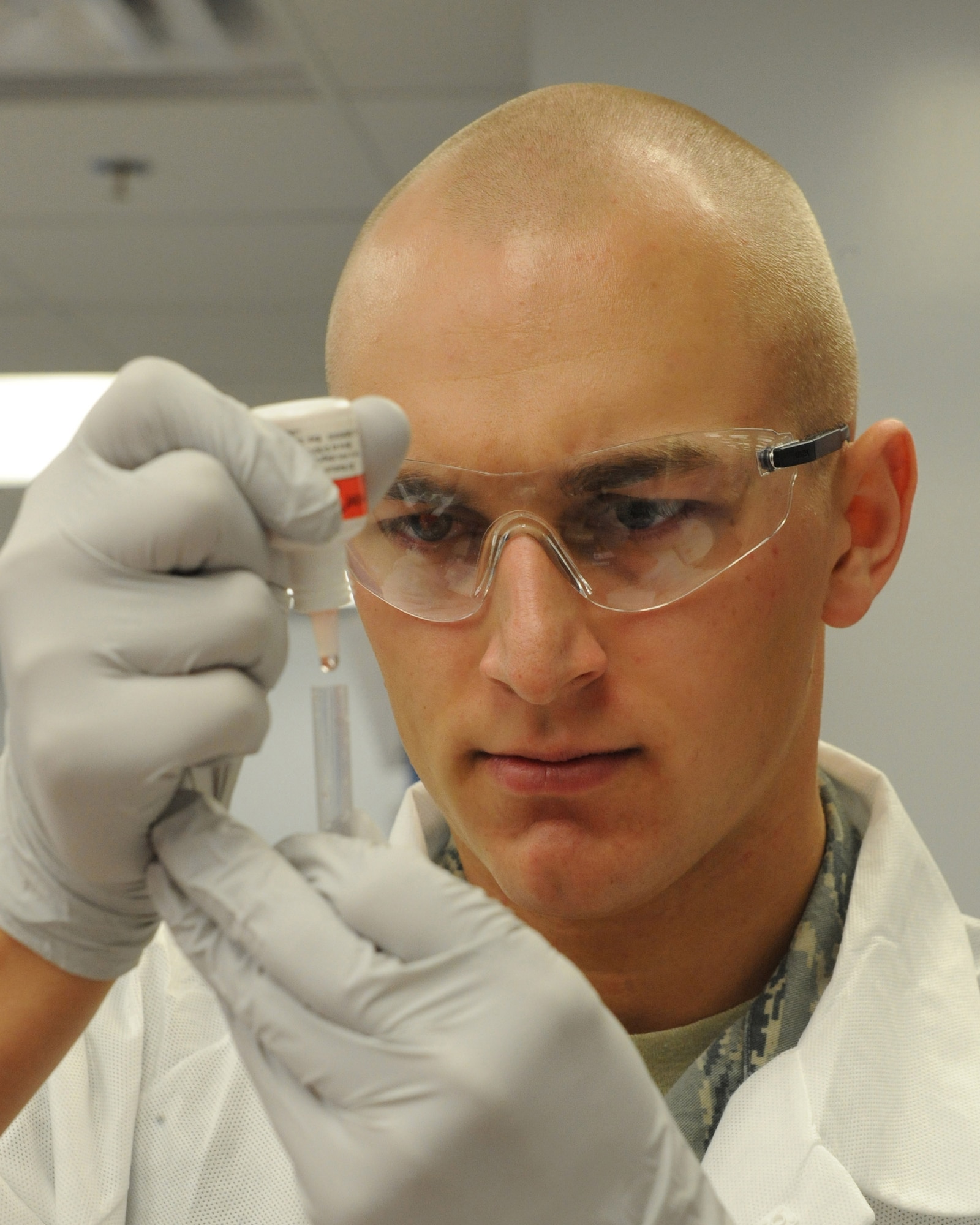 Airman 1st Class Grant Wendland, 19th Medical Group medical technician, performs a rapid strep test Feb. 26, trying to determine if a patient has a streptococcal infection. Airman Wendland uses a combination of sodium nitrite and acetic acid to indicate the presence of the polysaccharide antigen characteristic of Group A streptococci. (U.S. Air Force photo by Staff Sgt. Chad Chisholm)