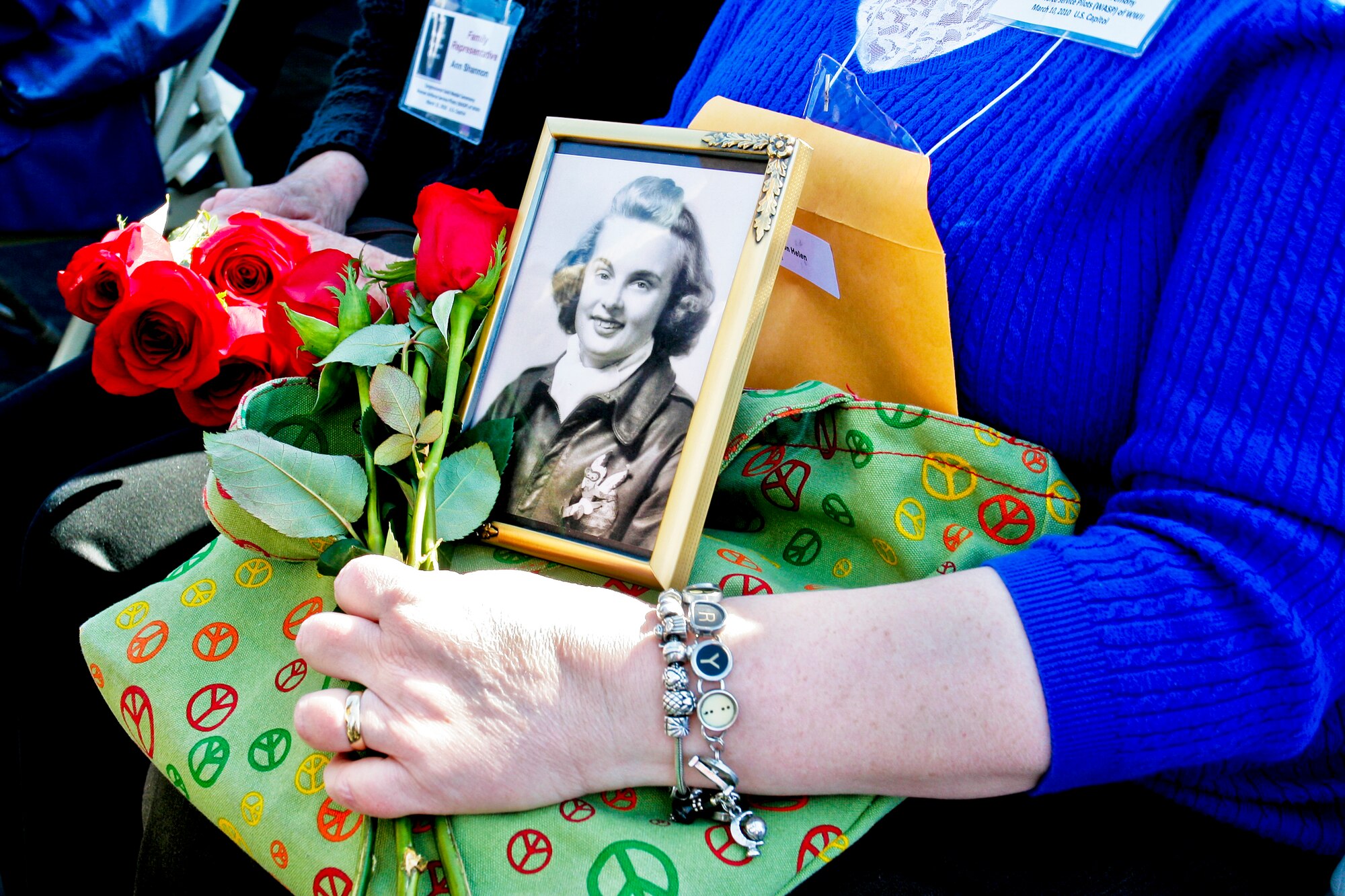 Jan Nicolai holds a photo of Helen Jo Anderson Severson, a deceased pilot from South Dakota who flew with the Women Airforce Service Pilots during World War II during a wreath-laying and remembrance ceremony for all 1,102 pilots March 9, 2010, at the Air Force Memorial in Arlington, Va. The ceremony was part of a two-day event in which all pilots will receive the Congressional Gold Medal at the U.S. Capitol for their service. (Defense Department photo/Linda Hosek)