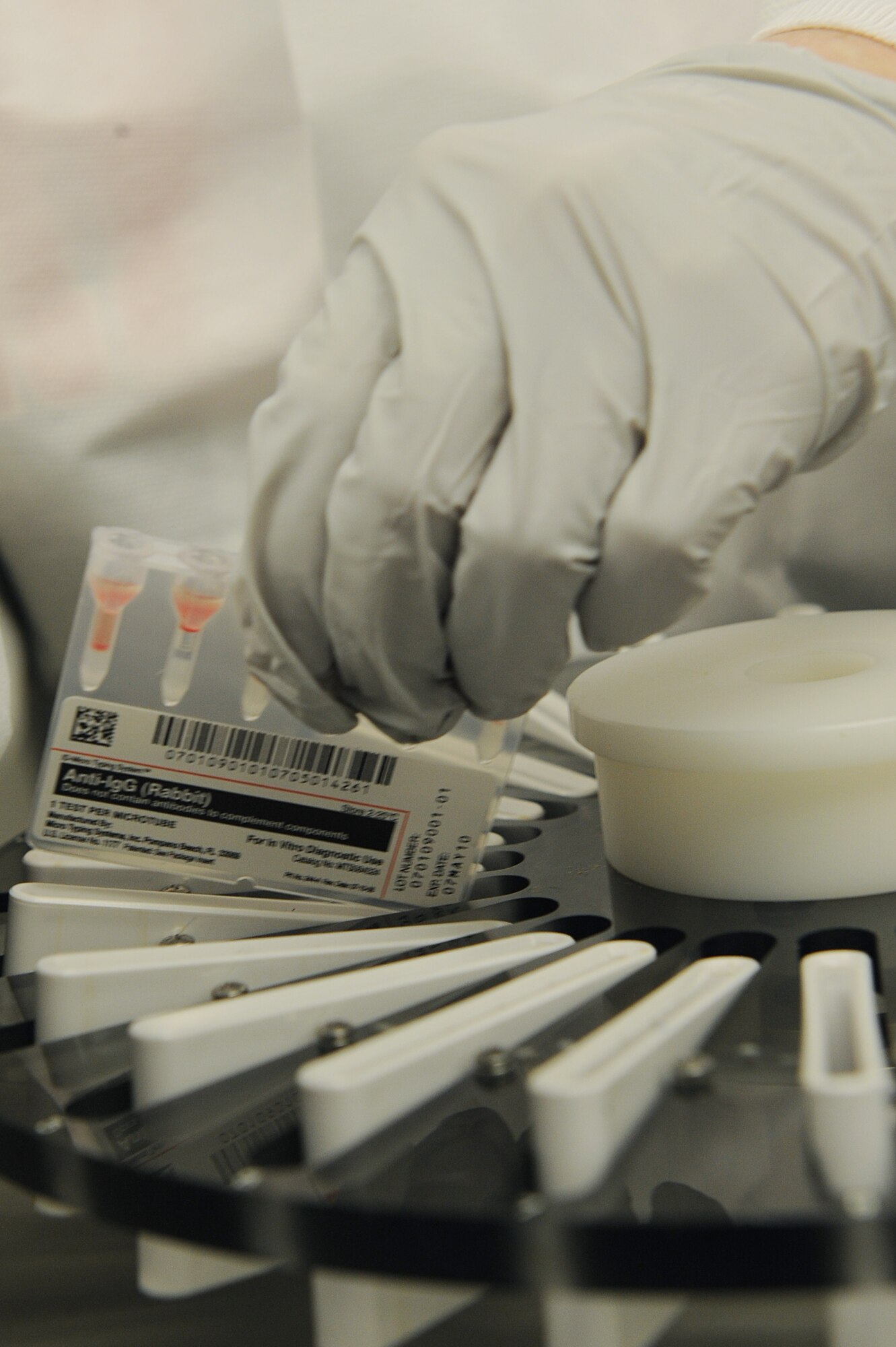 Rhonda Johnson, 19th Medical Group medical technician, inserts ID-Micro Typing System test samples into a medical centrifuge Feb. 3. The centrifuge is used to separate the heavier blood from lighter plasma in certain blood tests. (U.S. Air Force photo by Staff Sgt. Chad Chisholm)