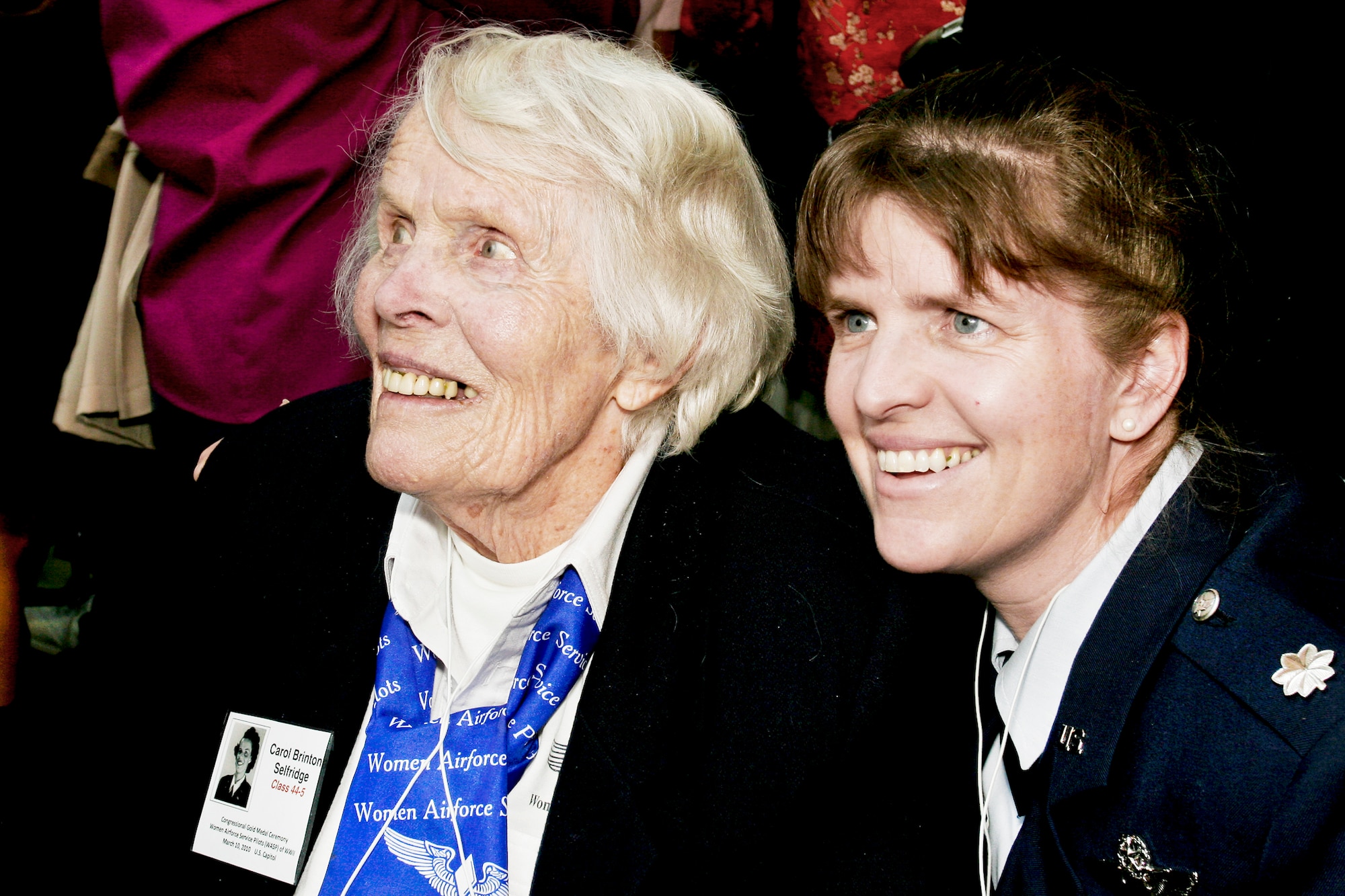 Carol Brinton Selfridge, 92 and a member of the Women Airforce Service Pilots Class 44-5, and her grandaughter, Lt. Col. Christy Kayser-Cook, share a moment during the reception to honor women civilian pilots who flew with the Women Airforce Service Pilots at the Women in Military Service for America Memorial March 9, 2010, at Arlington National Cemetery, Va. The reception followed a wreath-laying ceremony and both were part of a two-day event in which all pilots will receive the Congressional Gold Medal at the U.S. Capitol. (Defense Department photo/Linda Hosek)