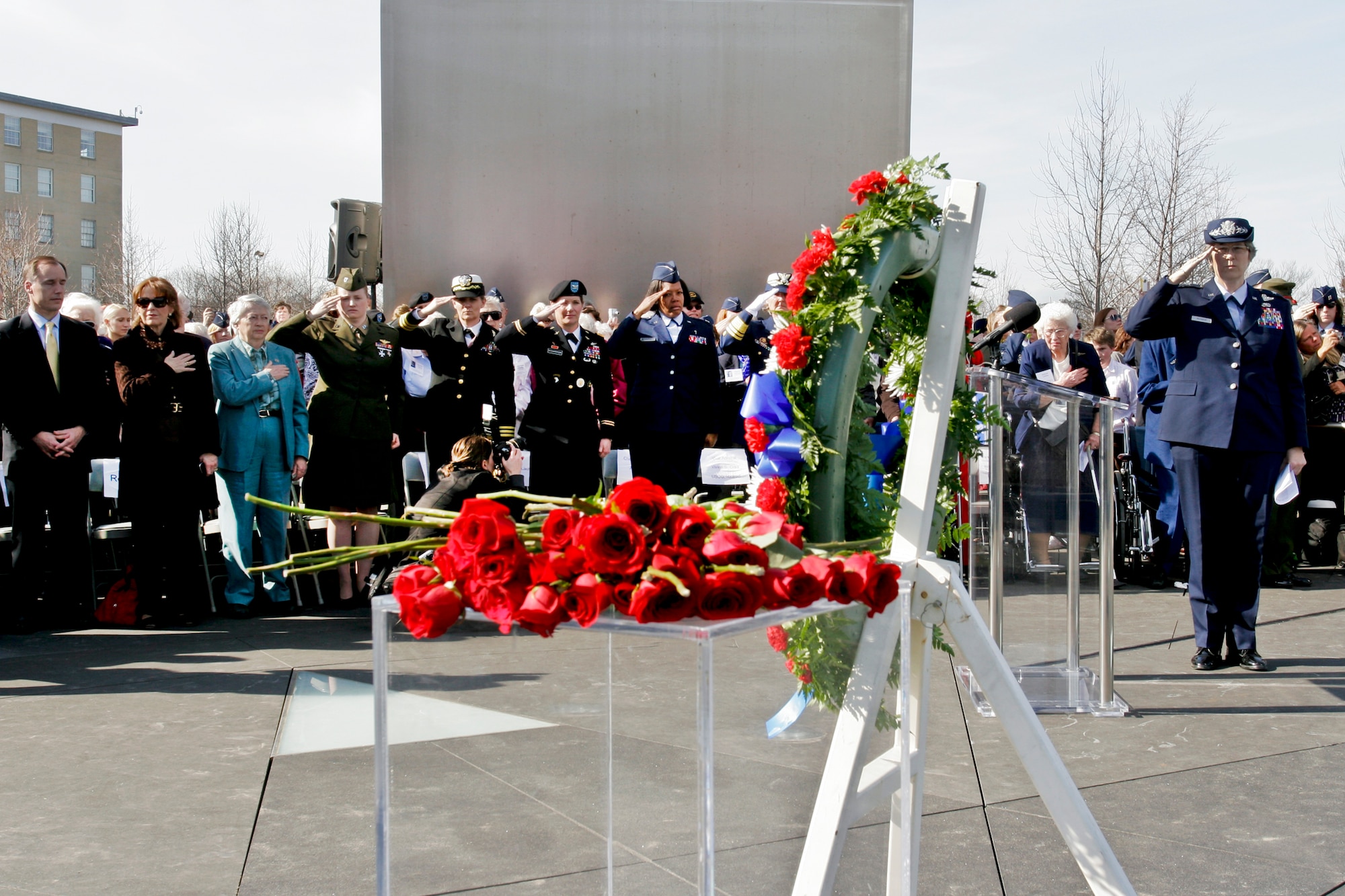 Women Airforce Service Pilots of World War II, military members and guests salute a wreath and roses dedicated to the 38 out of 1,102 women pilots who died during service to their country during a ceremony March 9, 2010, at the Air Force Memorial in Arlington, Va. The ceremony was part of an event in which all pilots will be awarded the Congressional Gold Medal at the U.S. Capitol. The women were civilian pilots and the first to fly military aircraft under the direction of U.S. forces. Fewer than 300 women are alive and more than half were expected to attend the events. (Defense Department photo/Linda Hosek)