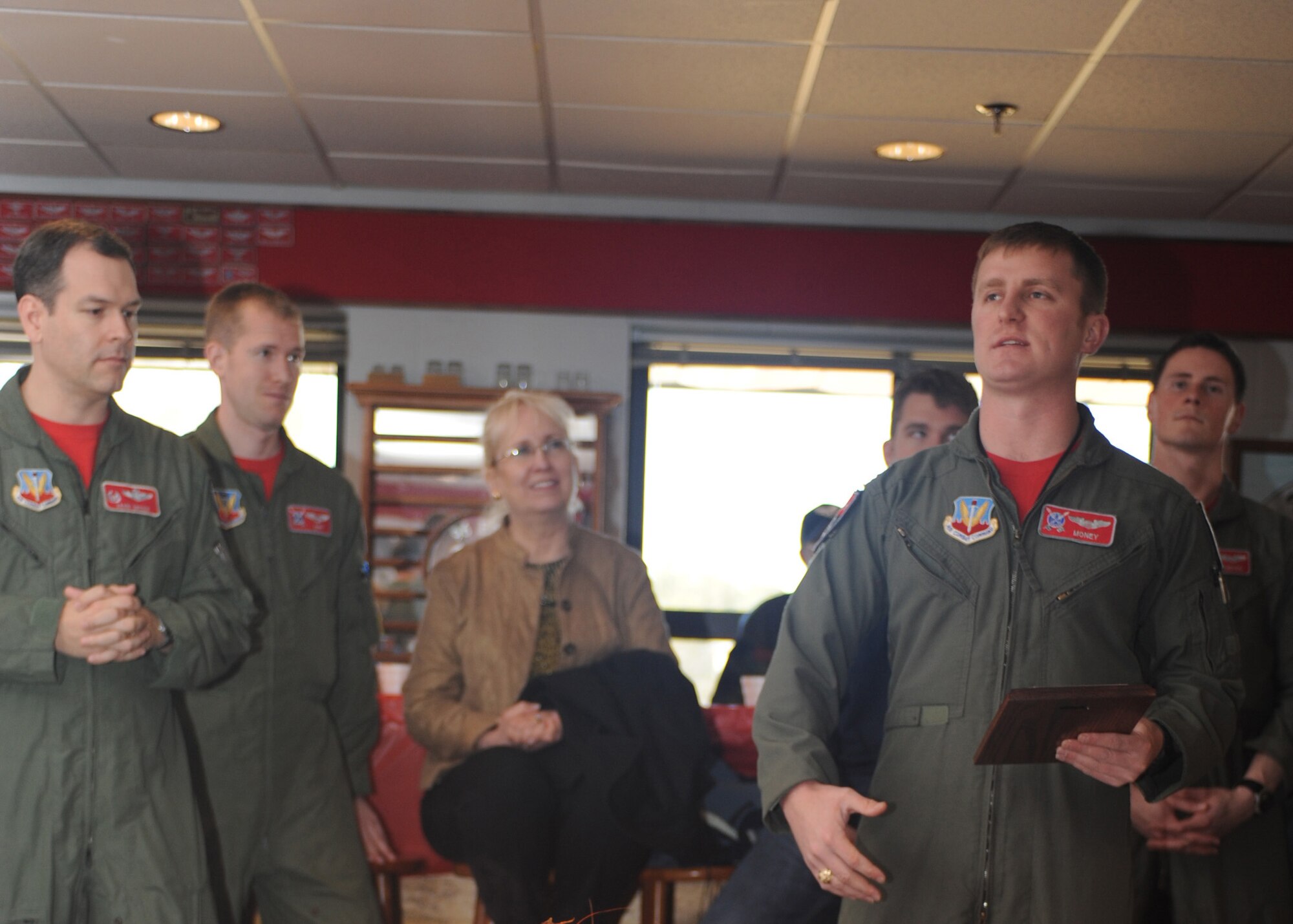 First Lt. Mike Malone, 333rd Fighter Squadron student pilot, hands outs plaques to instructors who stood out throughout the course during the squadron's Basic Course 09-CBE Red Carpet Day lunch at Seymour Johnson Air Force Base, N.C., March 5, 2010.  The B-Course curriculum consisted of academics, simulators and flight training which involved all aspects of the F-15E mission.  Students started with basic flying maneuvers and steadily ramped-up to more challenging air-to-air and air-to-ground missions. (U.S. Air Force photo/Tech. Sgt. Lesley Waters)