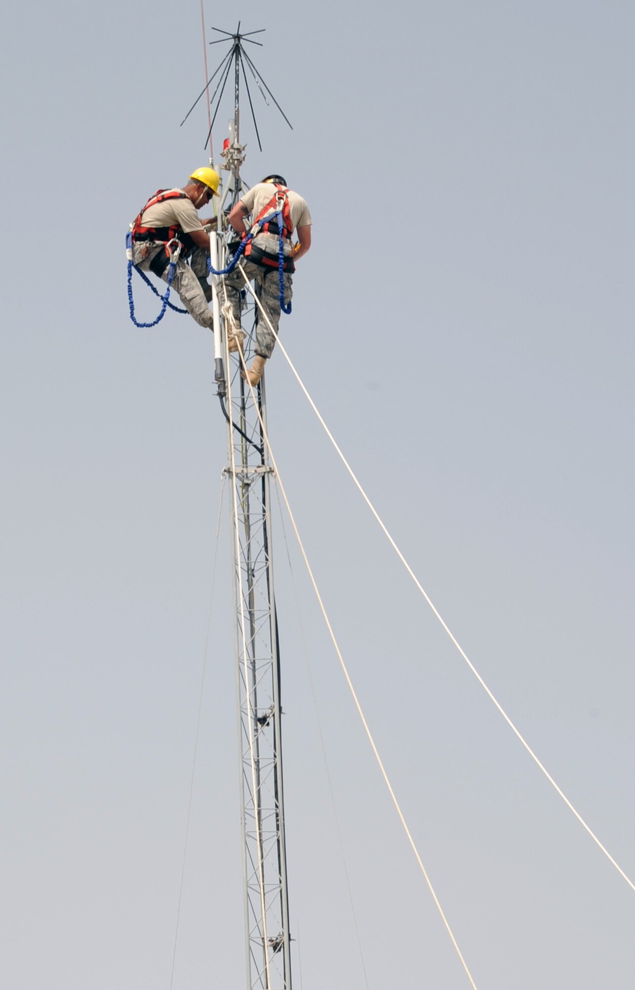 Airmen from the 380th Expeditionary Communications Squadron work on repairing connections on a tower during operations at a non-disclosed base in Southwest Asia on March 1, 2010.  The 390th ECS, as part of the 380th Air Expeditionary Wing, supports operations Iraqi Freedom and Enduring Freedom and the Combined Joint Task Force-Horn of Africa.  (U.S. Air Force Photo/Master Sgt. Scott T. Sturkol/Released)