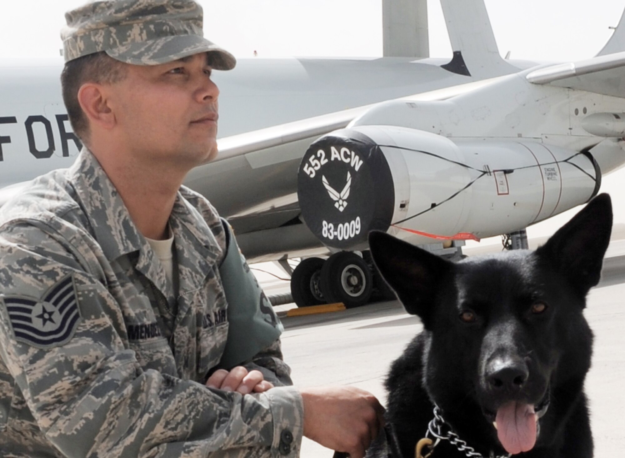 Tech. Sgt. Javier Mendez, and his military working dog Nero, patrol on the flightline of the 380th Air Expeditionary Wing at a non-disclosed base in Southwest Asia. Both Sergeant Mendez and Nero work as a military working dog team with the 380th Expeditionary Security Forces Squadron and are deployed from the 374th Security Forces Squadron at Yokota Air Base, Japan.  Sergeant Mendez' hometown is Los Angeles, Calif. (U.S. Air Force Photo/Master Sgt. Scott T. Sturkol/Released)