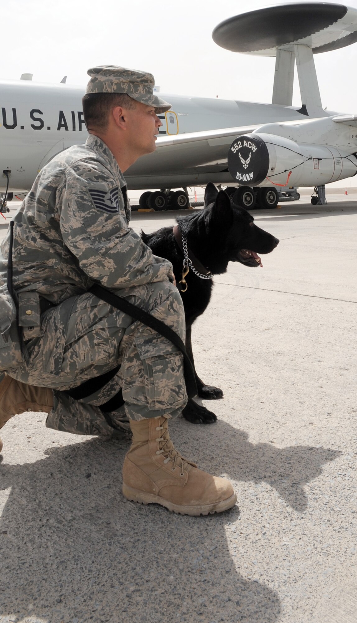 Tech. Sgt. Javier Mendez, and his military working dog Nero, patrol on the flightline of the 380th Air Expeditionary Wing at a non-disclosed base in Southwest Asia. Both Sergeant Mendez and Nero work as a military working dog team with the 380th Expeditionary Security Forces Squadron and are deployed from the 374th Security Forces Squadron at Yokota Air Base, Japan.  Sergeant Mendez' hometown is Los Angeles, Calif. (U.S. Air Force Photo/Master Sgt. Scott T. Sturkol/Released)