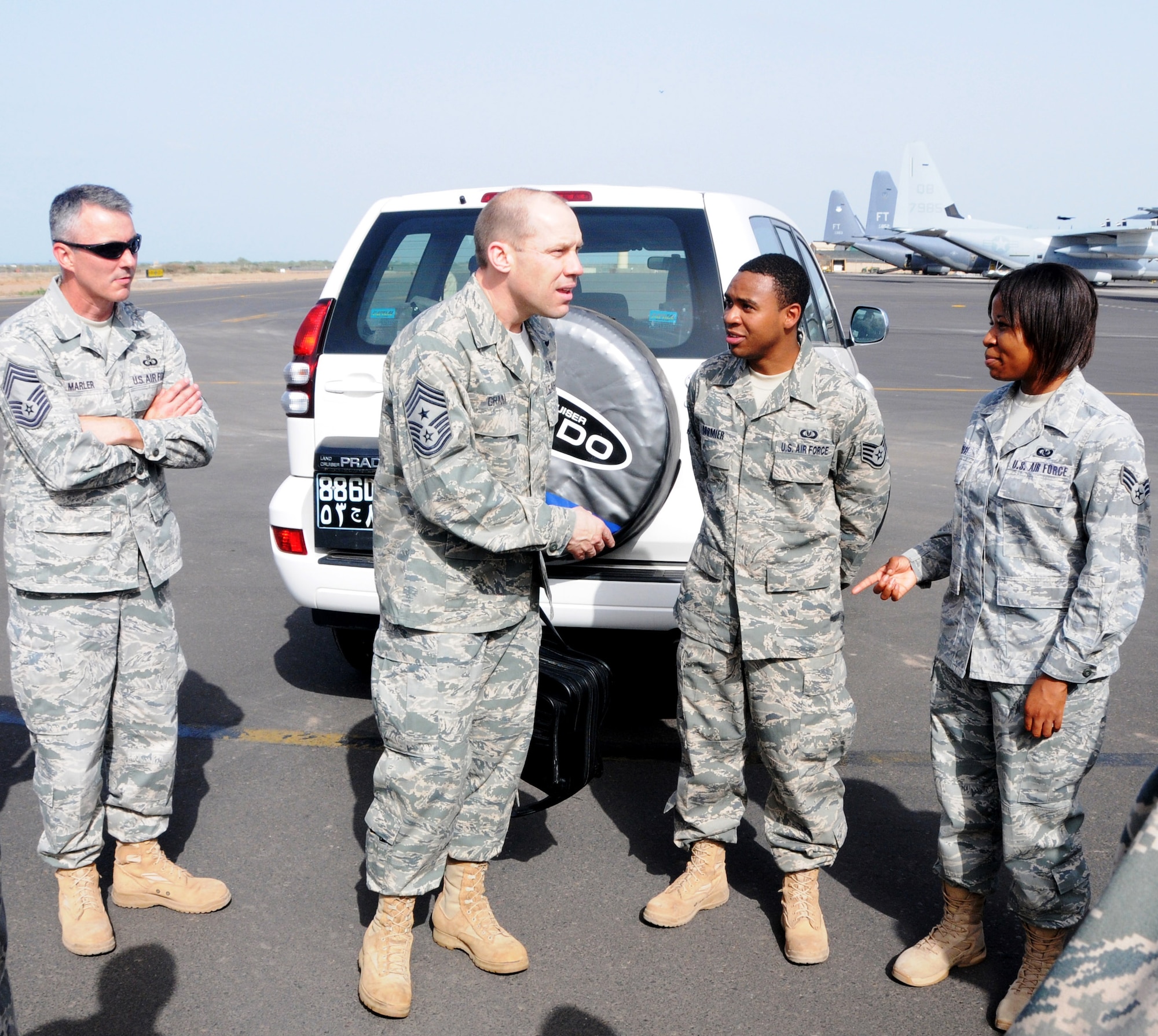 CAMP LEMONIER, Djibouti – 17th Air Force (Air Forces Africa) Command Chief Master Sgt. Mike Grimm (center) greets members of the 449th Air Expeditionary Group Staff Sgt. Reginald Cormier and Senior Airman Aisha Reese upon arrival here March 9. Looking on (left) is 449th group Superintendant Chief Master Sgt. Vincent Marler. Chief Grimm accompanied AFAFRICA Commander Maj. Gen. Ronald Ladnier to Camp Lemonier to visit with troops deployed there and attend the 449th change of command ceremony. Col. Matthew Smith, who has been heading up Combat Operations at the 617th Air and Space Operations Center, took command. (U.S. Air Force photo by Master Sgt. Jim Fisher)