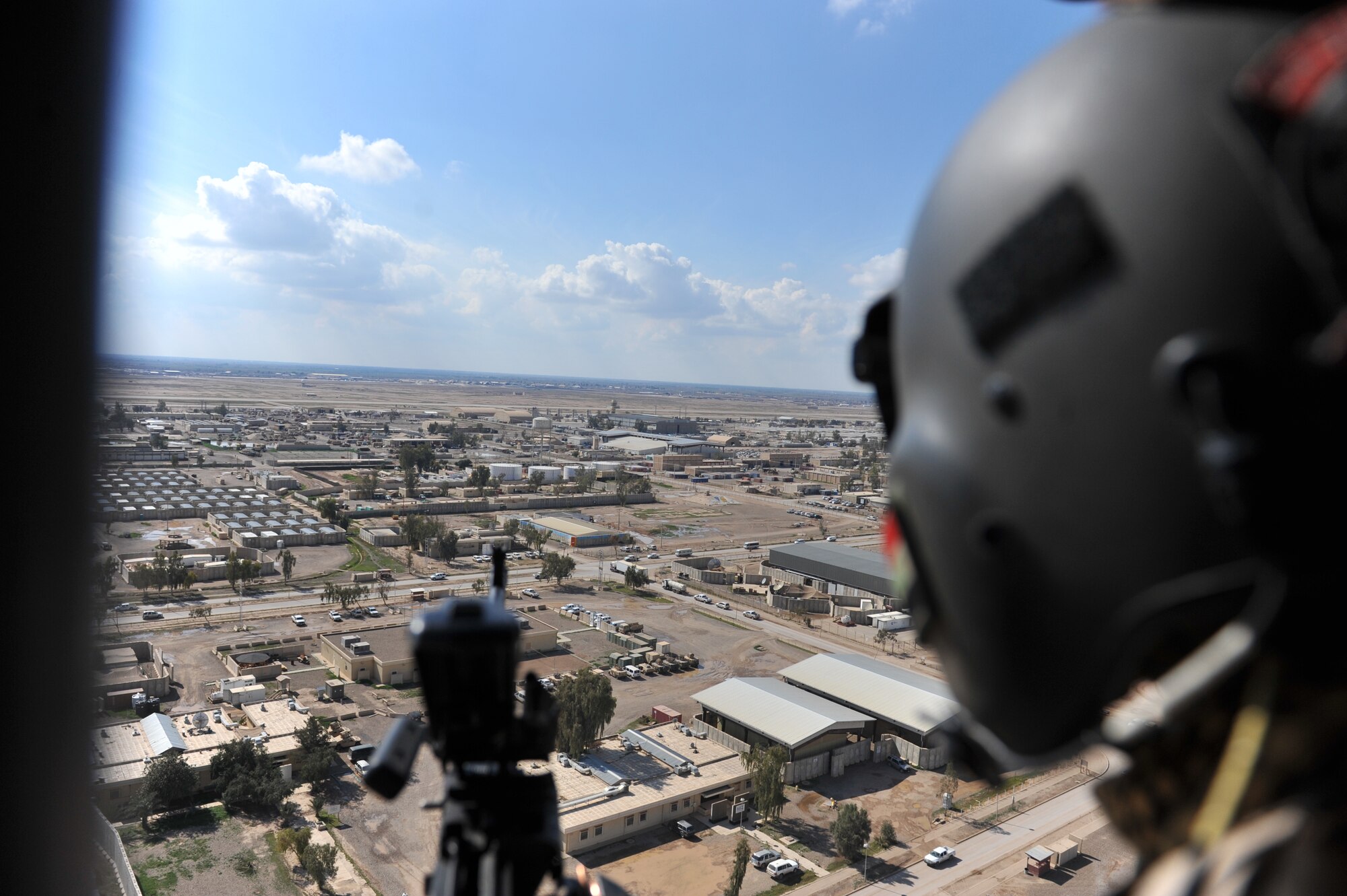 Iraqi Mi-17 helicopter aerial gunner, Athier Fiaz, scans the area during takeoff at Camp Taji, Iraq, March 2, 2010.
(U.S. Air Force photo/Staff Sgt. Quinton Russ/released)
