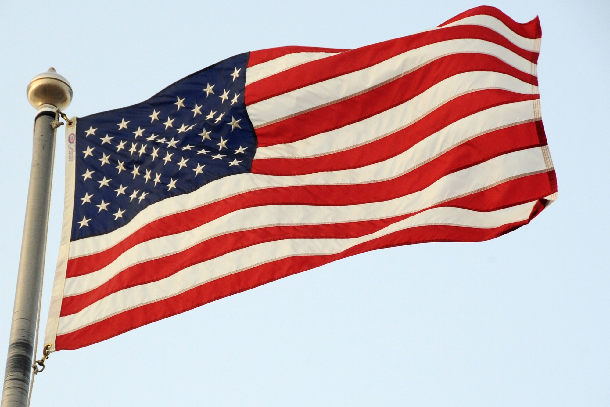 An American flag is flown during retreat at an undisclosed location in Southwest Asia on March 5, 2010.  Airmen from across the wing join every week to pay respect during retreat. The 380th Air Exepeditionary Wing supports Operations Iraqi Freedom and Enduring Freedom and the Combined Joint Task Force-Horn of Africa. The 380th AEW is comprised of four groups and 12 squadrons and the wing's deployed mission includes air refueling, surveillance and reconnaissance in support of overseas contingency operations in Southwest Asia.(U.S. Air Force photo/Senior Airman Jenifer H. Calhoun/Released)
