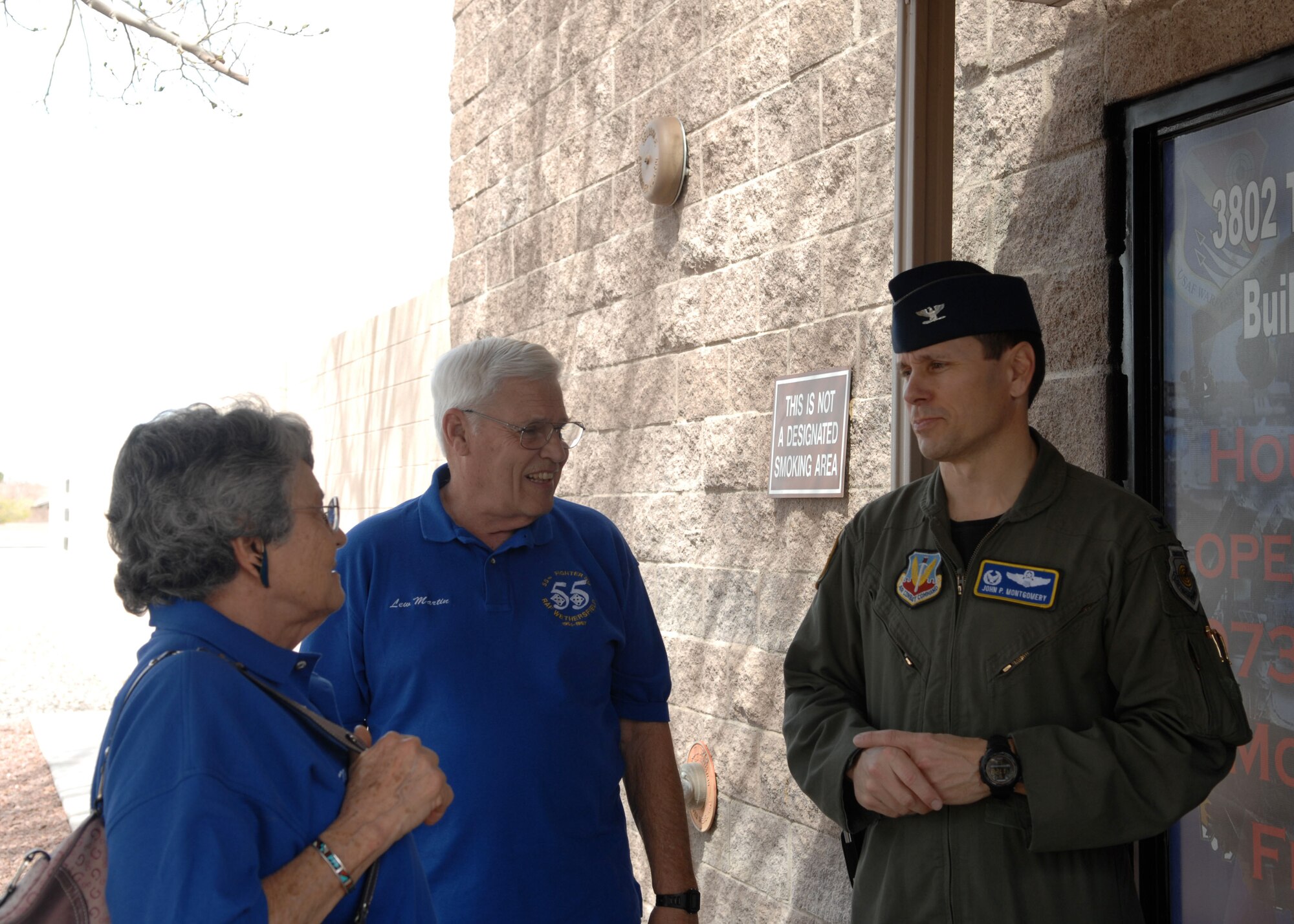 NELLIS AIR FORCE BASE, Nev. -- Colonel John "Bama" Montgomery, 98th Range Wing commander who commanded the 55th Fighter Squadron "Shooters" from 2003 to 2005, greets retired Air Force Col. John "Lew" Martin and his wife Ann outside the Threat Training Facility March 6. John Martin was a member of the 55th from 1964 to 1967. Nearly 20 Shooter alumni from every decade since World War II spent the weekend reflecting on their squadron heritage. (U.S. Air Force photo/2nd Lt. Emily Chilson)