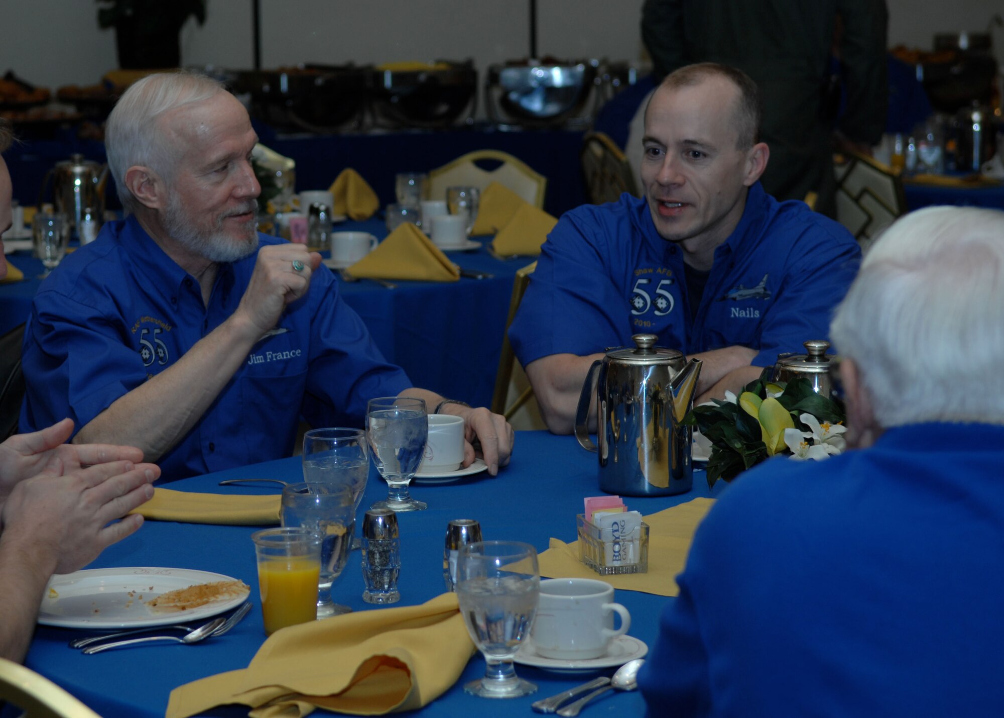 LAS VEGAS -- Retired Air Force Lt. Col. Jim France, 55th Fighter Squadron "Shooter" alum (left), speaks with Lt. Col. Jason "Nails" Plourde, 55th FS director of operations, during a Shooter reunion breakfast March 6. Nearly 20 Shooter alumni joined the current members of the 55th for a reunion. (U.S. Air Force photo/2nd Lt. Emily Chilson)