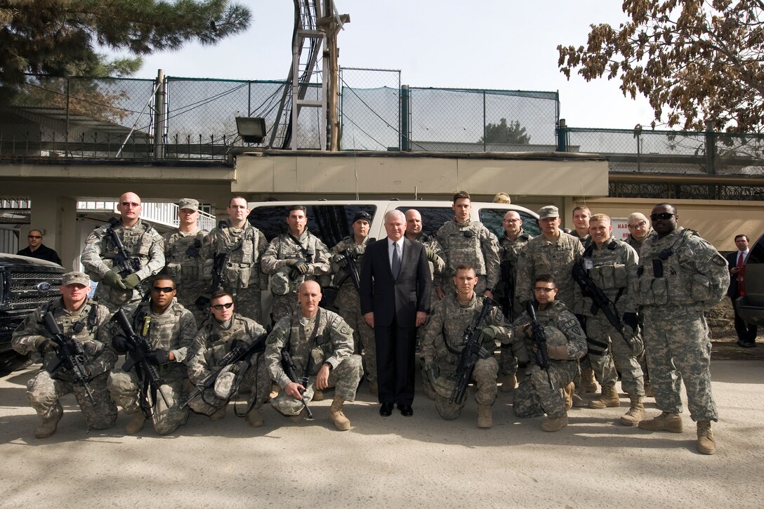 U.S. Defense Secretary Robert M. Gates poses for a photo with U.S. troops on Camp Eggers, Kabul, March 10, 2010.