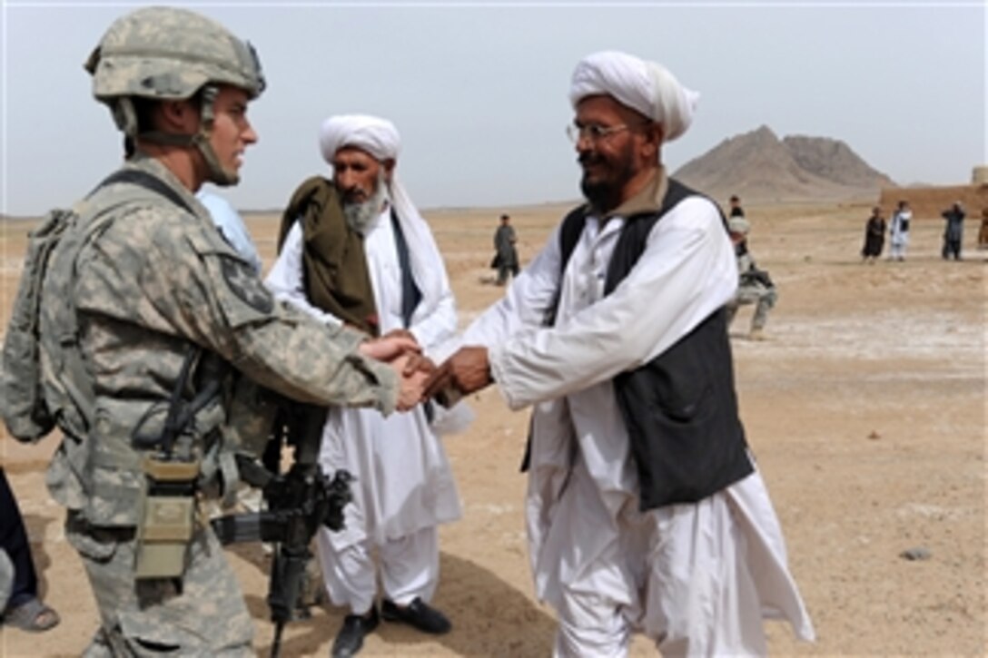 U.S. Army 1st Lt. David J. Leydet, with 3rd Platoon, Bear Troop, 8th Squadron, 1st Cavalry Regiment, greets an elder during a population engagement in Taktehpol, Afghanistan, on March 2, 2010.  
