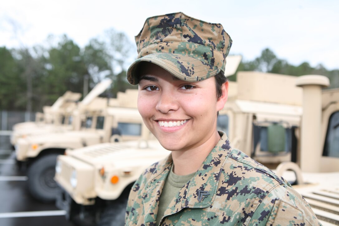 Cpl. Amy Gentry, a military policeman with Military Police Company, Combat Logistics Regiment 27, 2nd Marine Logistics Group, stands in the company's vehicle compound aboard Camp Lejeune, N.C., March 11, 2010.  Gentry won the second place in the Individual Pistol portion of the Camp Lejeune 2010 Intramural Small-Arms Competition held in early March. Gentry was also nominated as CLR-27's outstanding woman in honor of Women's History Month. (U.S. Marine Corps photo by Gunnery Sgt. Katesha Washington)