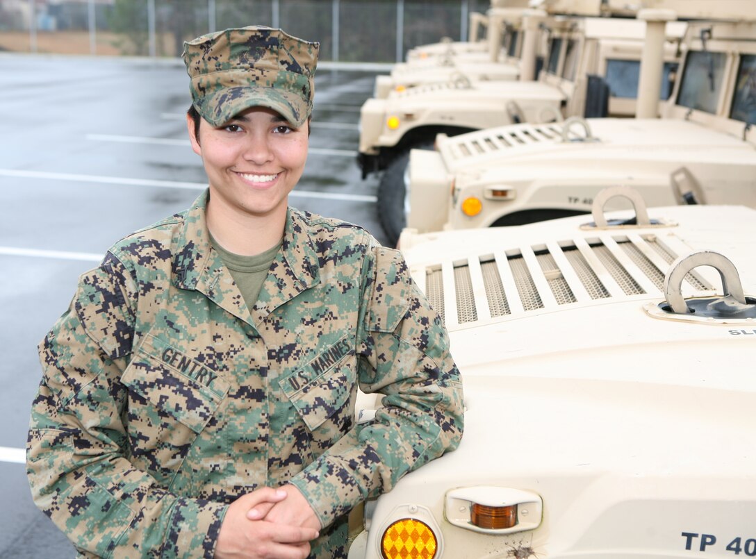 Cpl. Amy Gentry, a military policeman with Military Police Company, Combat Logistics Regiment 27, 2nd Marine Logistics Group, stands in the company's vehicle compound aboard Camp Lejeune, N.C., March 11, 2010.  Gentry won the second place in the Individual Pistol portion of the Camp Lejeune 2010 Intramural Small-Arms Competition held in early March. Gentry was also nominated as CLR-27's outstanding woman in honor of Women's History Month. (U.S. Marine Corps photo by Gunnery Sgt. Katesha Washington)