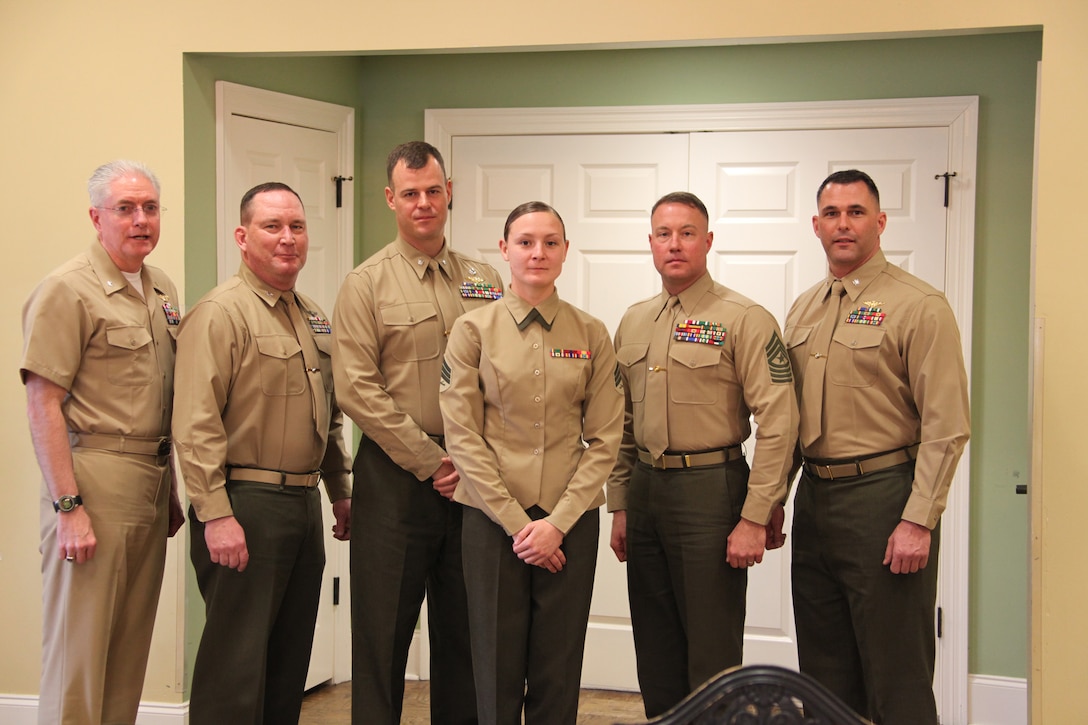 (from left to right) Chaplain Carl Koch, station Chaplin, Col. Douglas A. Denn, Cherry Point’s commanding officer, Lt. Col. Alan W. Solter, director of community planning liaison office, Sgt. Angie Fike, a collateral duty inspector with Marine Transportation Squadron 1, Sgt. Maj. Michael Daley, VMR-1 sergeant major, and Lt Col. Travis Powers, VMR-1 Maintenance officer, poses during the New Bern Military Family of the Quarter awards at the New Bern Golf and Country Club, March 11. Fike was awarded the MFOQ award for her dedication to her Marines and her community.