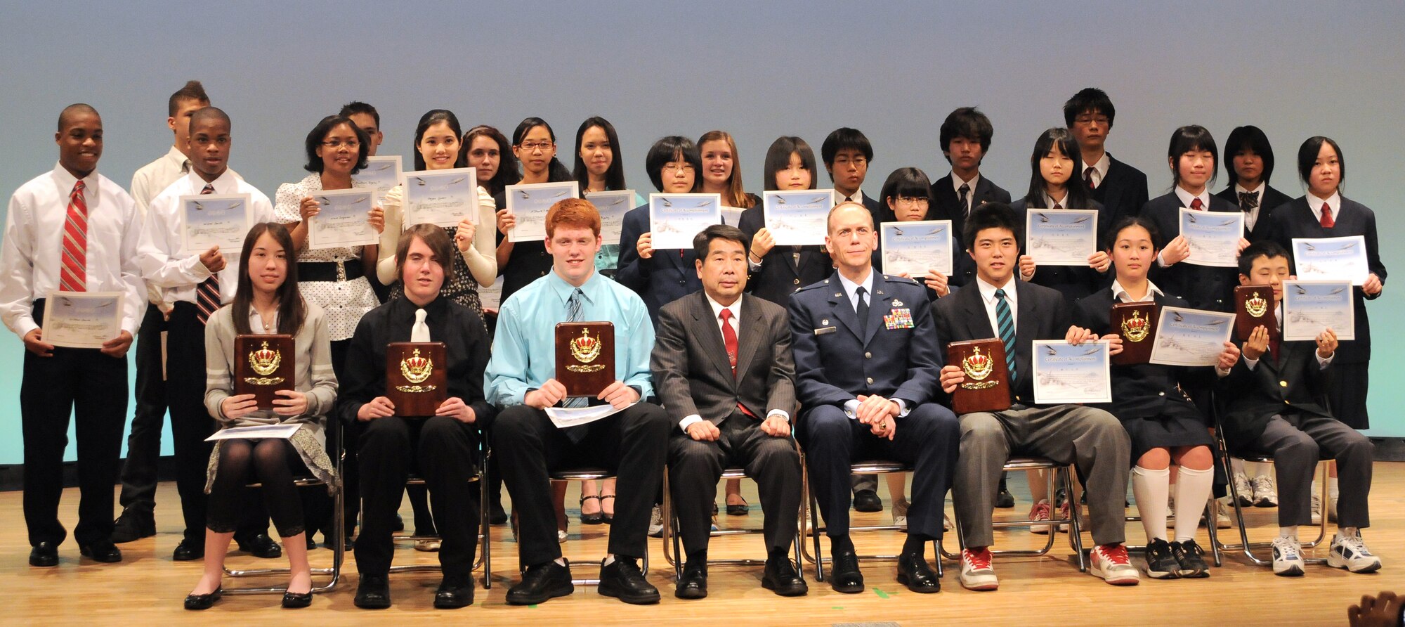 FUSSA, Japan -- The participants of the Japan-United States Speech Contest gathered for photos after the contest had finished, March 5. The North Kanto Defense Bureau hosted the Japan-United States Speech Contest to encourage cultural exchange between Japan and the United States. (U.S. Air Force photo/Airman 1st Class Katrina R. Menchaca)