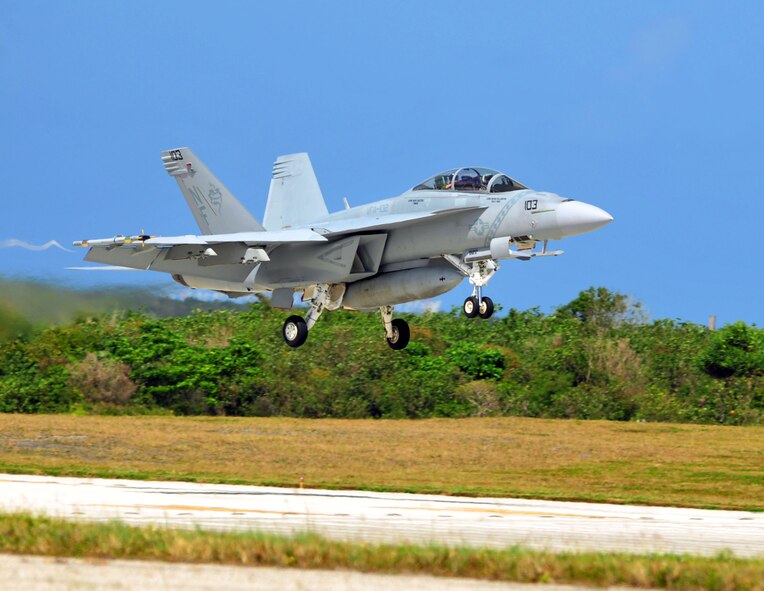 ANDERSEN AIR FORCE BASE, Guam - An F-18 Hornet lands here on Mar. 9. The f-18 is deployed here in support of the Strike Fighter Advance Readiness Program (SFARP). The program is a Navy exercise designed to allow pilots to practice war skills against credible adversaries before facing real world threats. (U.S. Air Force photo by Airman 1st Class Julian North)
