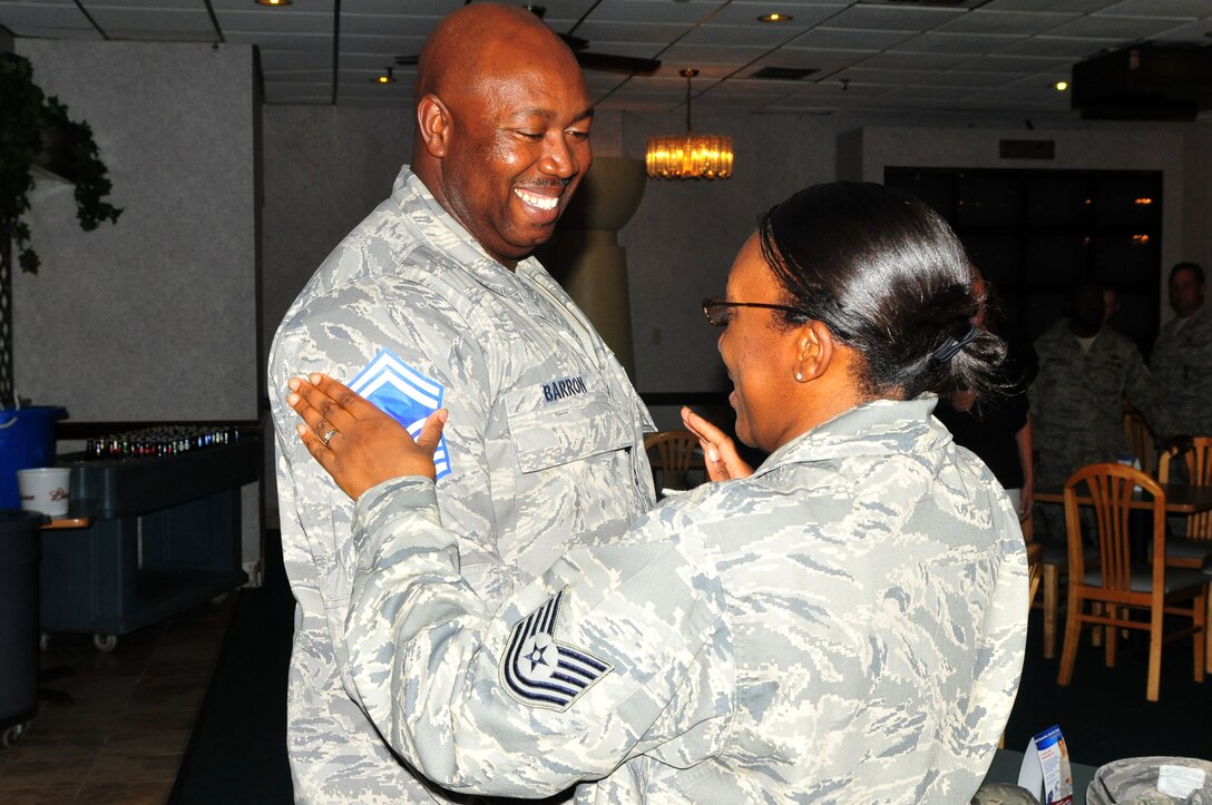 ANDERSEN AIR FORCE BASE, Guam - Senior Master Sgt. Cedric Barron recieves his honorary stripes from his wife, Technical Sgt. Nikeya Barron, here on Mar. 5. SMSgt. Barron was recently part of the group who were promoted from Master to Senior MSgt.   (U.S. Air Force photo by Airman 1st Class Julian North)
