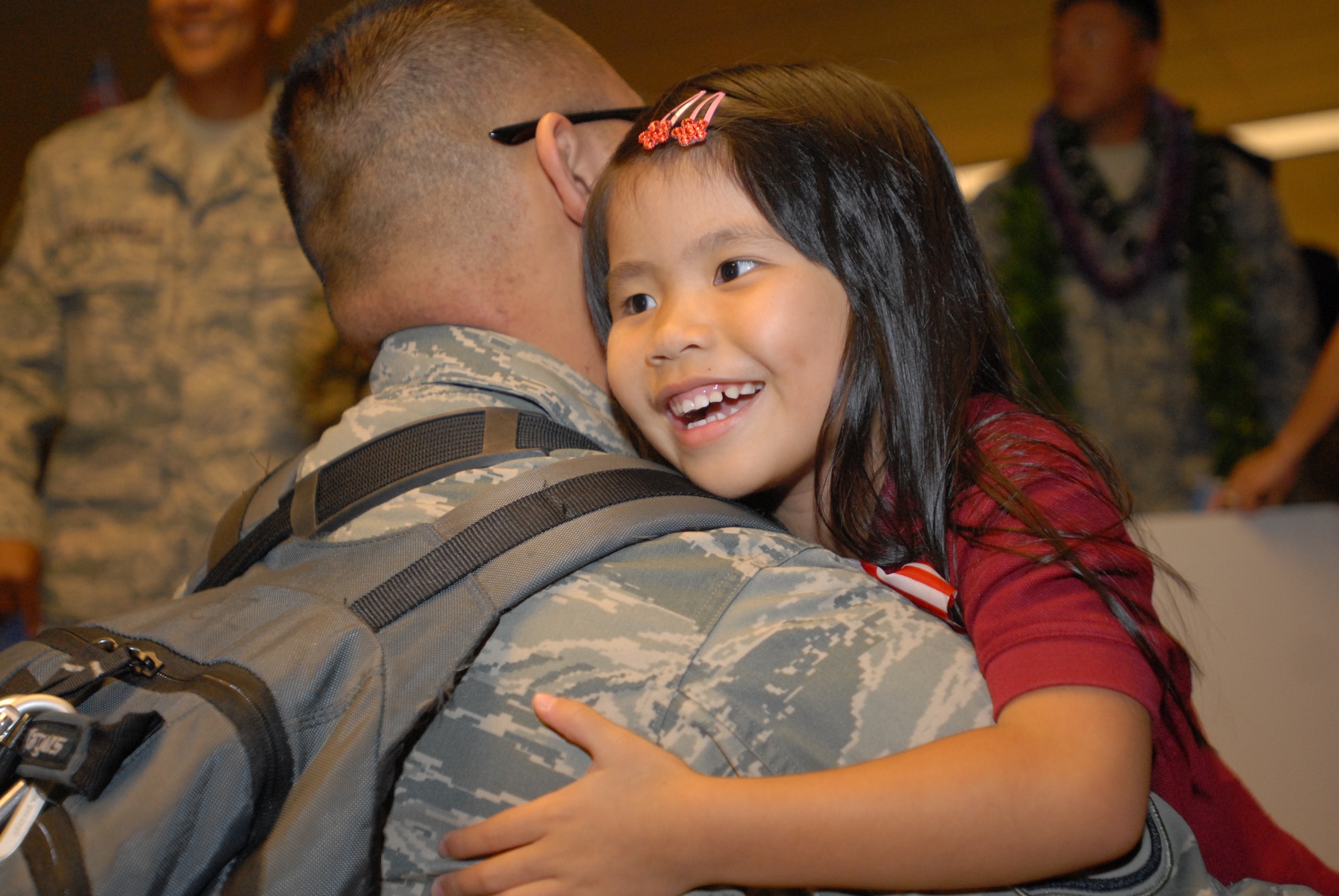 JOINT BASE PEARL HARBOR HICKAM, Hawaii – Crishelle Ildefonso,5, gives a long awaited hug to her father, Tech. Sgt. Cris Ildefonso, 624th Regional Support Group’s Civil Engineer Squadron, at the Honolulu International Airport, March 10. The 624th RSG/CES returns from deployment after a 7 month tour to Afghanistan, where they were part of the 577th Expeditionary Prime Base Engineer Emergency Force Squadron. (U.S. Air Force photo/Senior Airman Gustavo Gonzalez)