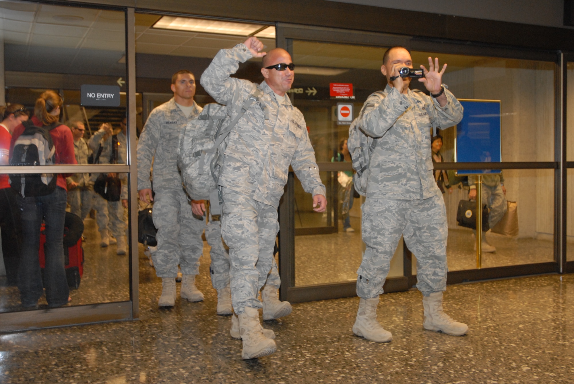 JOINT BASE PEARL HARBOR HICKAM, Hawaii – Airmen from the 624th Regional Support Group’s Civil Engineer Squadron return home at the Honolulu International Airport, March 10. The 624th RSG/CES returns from deployment after a 7 month tour to Afghanistan, where they were part of the 577th Expeditionary Prime Base Engineer Emergency Force Squadron. (U.S. Air Force photo/Senior Airman Gustavo Gonzalez)