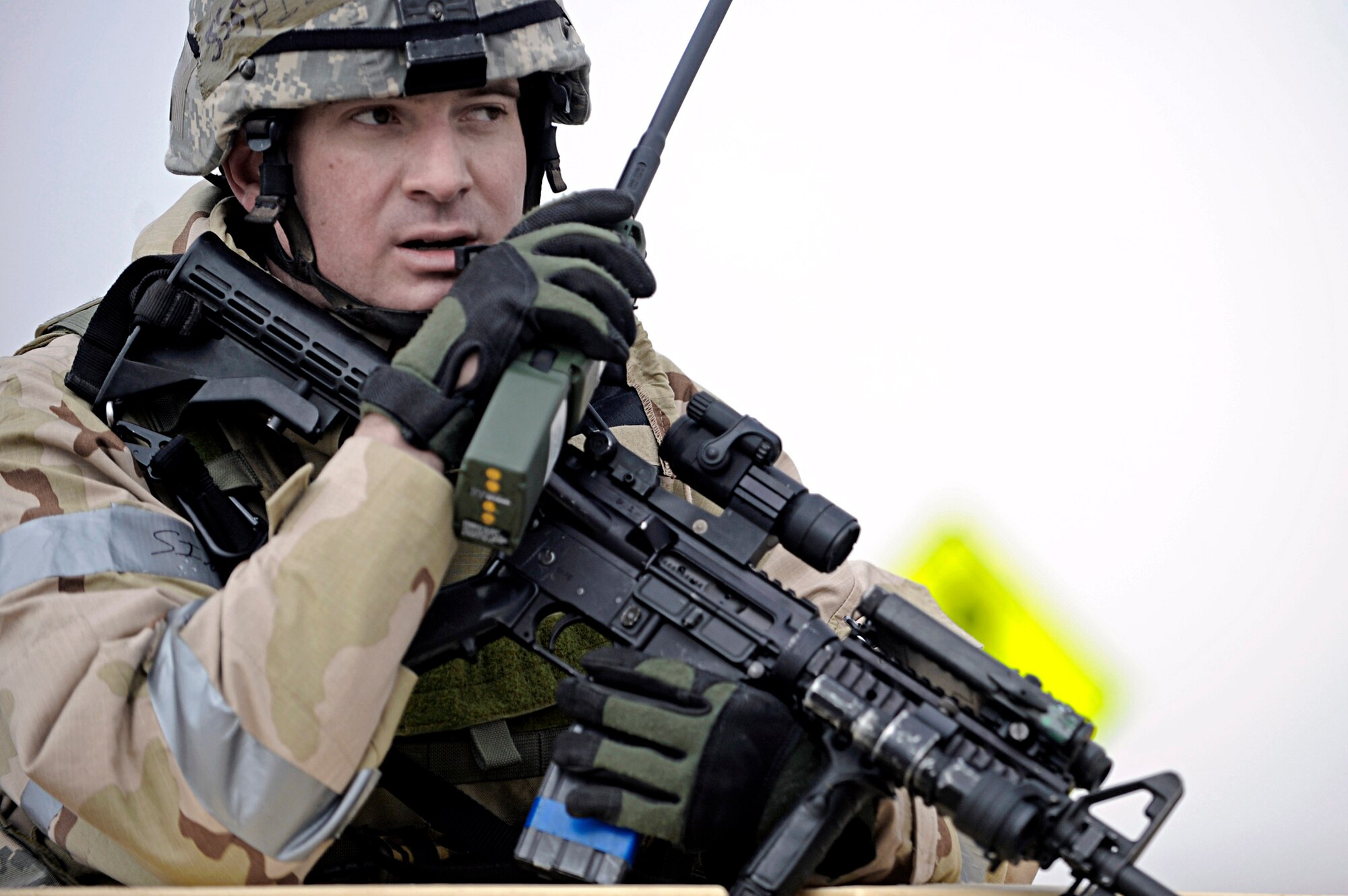 Staff Sgt. Ben Pieta, a 28th Security Forces Squadron patrolman, radios to other 28 SFS members after eliminating a "threat" at an entry control point for Ellsworth Air Force Base, S.D., March 3, 2010. Sergeant Pieta is participating in an operational readiness exercise that provided training and prepared Airmen for worldwide deployments. (U.S. Air Force photo/Airman 1st Class Matthew Flynn)