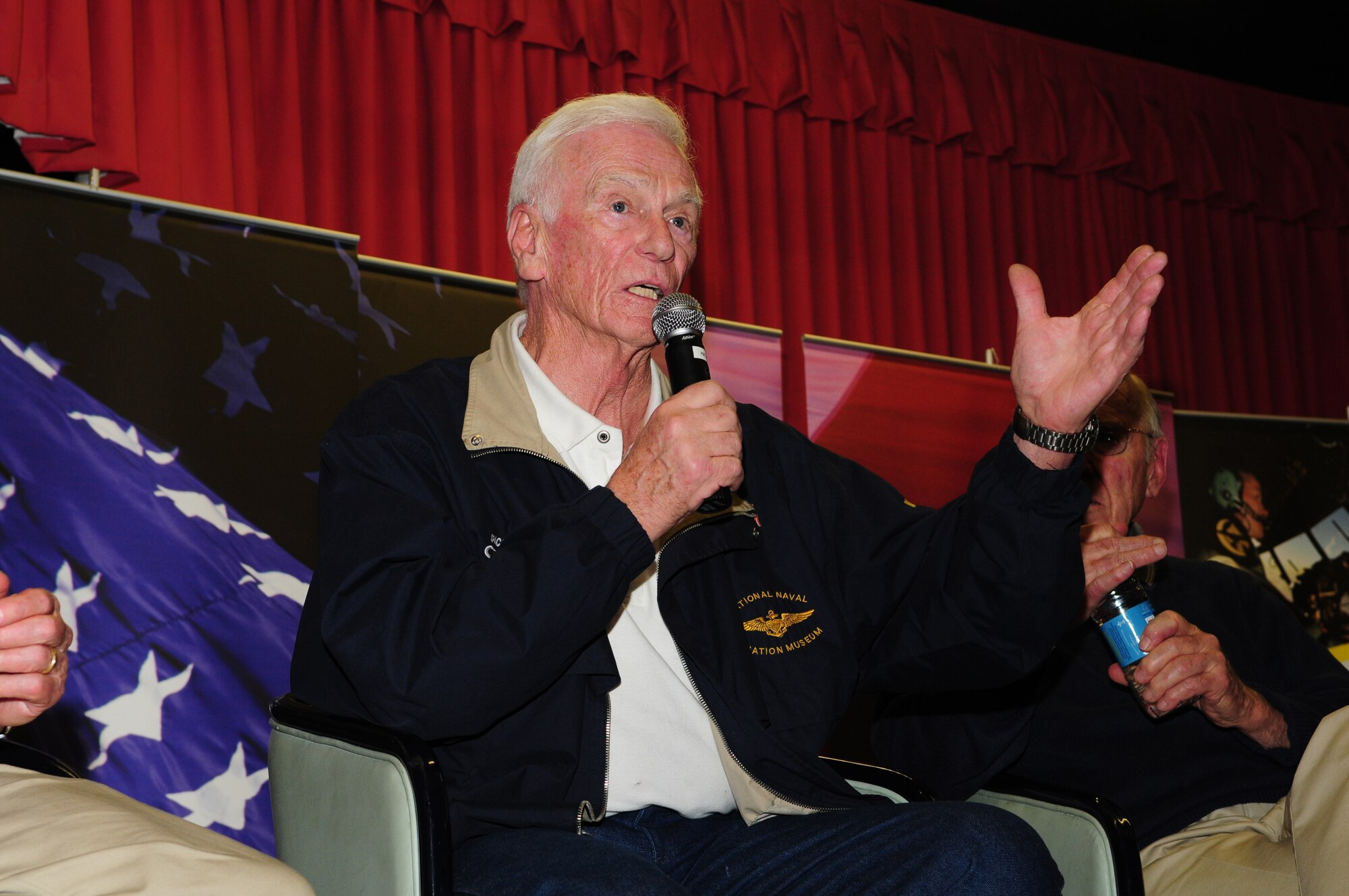 RAF MILDENHALL, England – Gene Cernan, the last astronaut to walk on the moon, speaks to a crowd at RAF Mildenhall’s Galaxy Club during a “Legends of Aerospace: The Impossible Is Possible” tour March 11. (U.S. Air Force photo/Karen Abeyasekere)