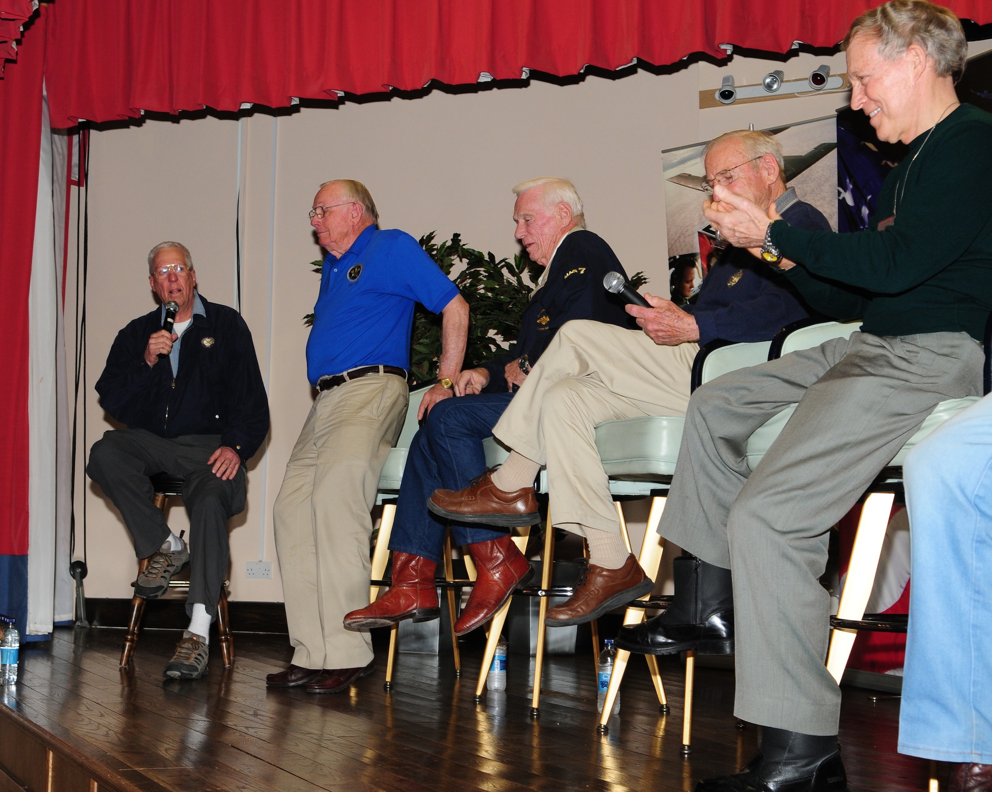RAF MILDENHALL, England – Neil Armstrong (blue shirt) stands as he receives a standing ovation during a “Legends of Aerospace: The Impossible Is Possible” tour at RAF Mildenhall’s Galaxy Club March 11. With him (left to right) were: Former “Good Morning America” host, David Hartman; the last astronaut to walk on the moon, Gene Cernan; Apollo 13 commander, Jim Lovell; last Air Force pilot ace, Steve Ritchie; and SR-71 chief test pilot, Bob Gilliland. (U.S. Air Force photo/Karen Abeyasekere)