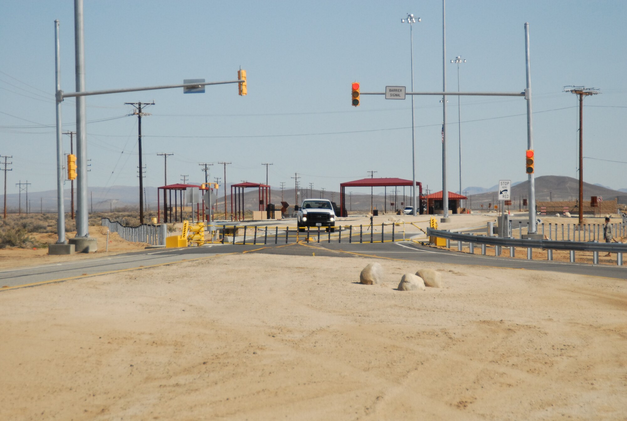 95th Security Forces Squadron deployed the recently installed Final Denial Barrier System at the North Gate.  The deployment of the barrier net is managed from the entry control point upon entering the base.  The same FDB system was installed at the South Gate. The West Gate is undergoing installation of the same system, as well as a visitor pass office. The West Gate project is scheduled to be completed in October.  (Air Force photo/ Stephen K. Robinson)